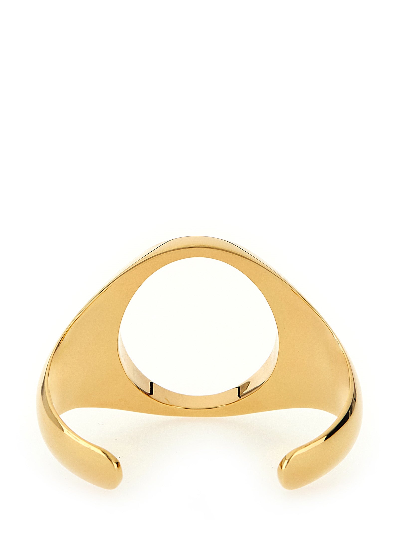 Elevate your elegance with the MM6 Maison Margiela Gold Brass Bracelet, a masterpiece of gilded craftsmanship that embodies timeless sophistication and individuality.