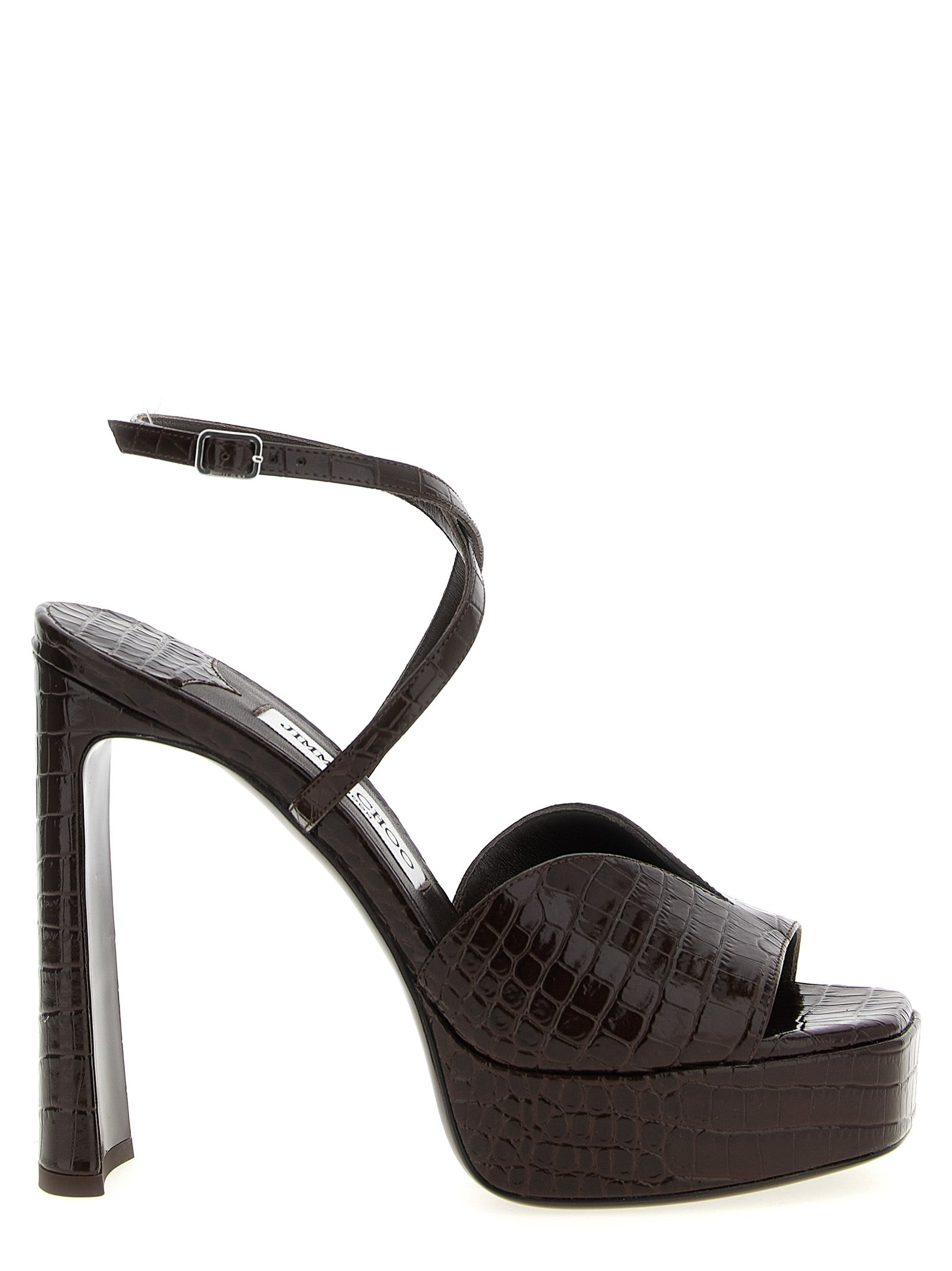 Step into the realm of luxury with Jimmy Choo's Karli Brown Leather Stiletto Heel Sandals, crafted from exquisite crocodile-print leather for an unforgettable allure.