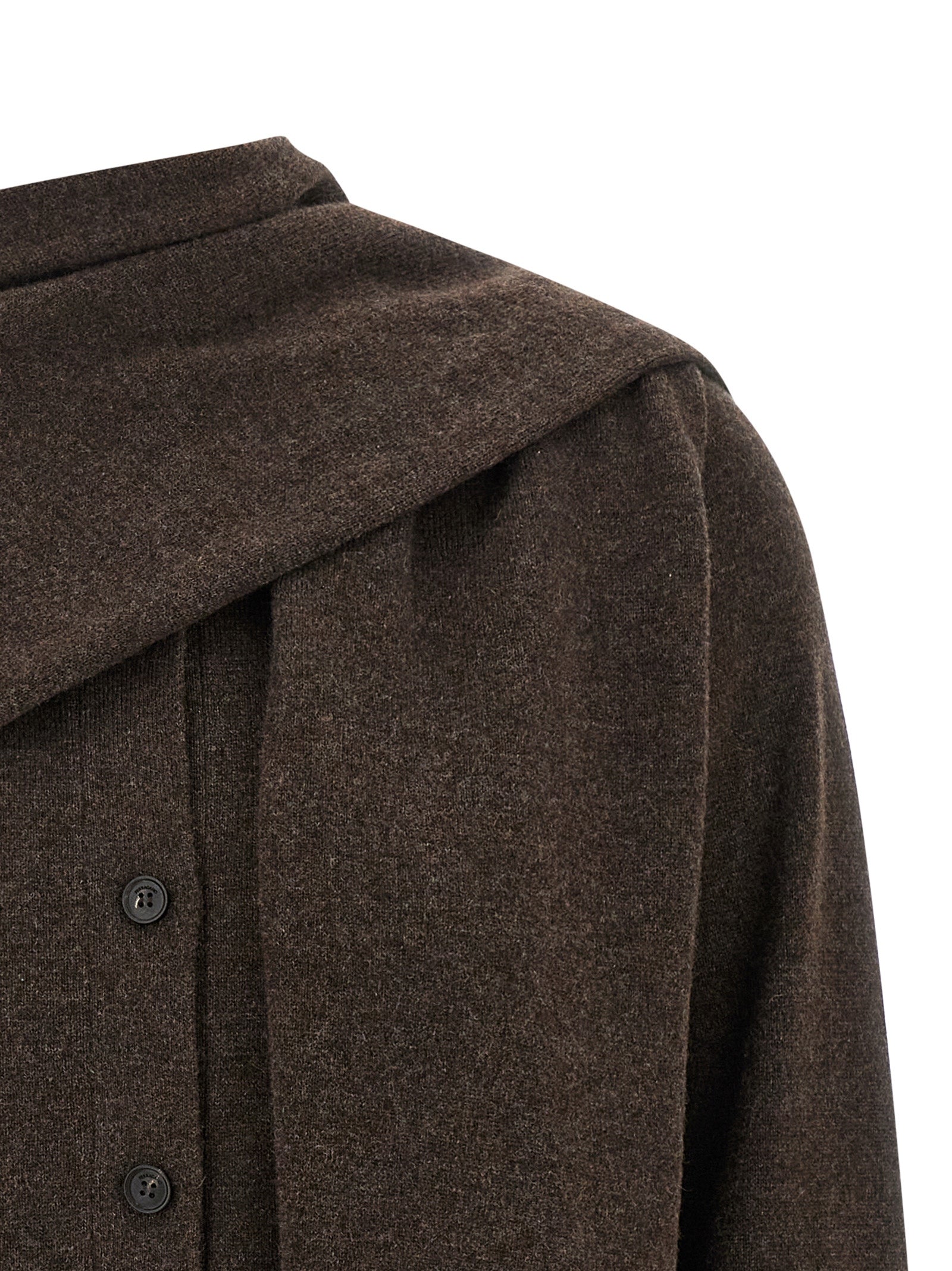 Indulge in the Ferragamo Brown Cashmere Cardigan, a masterpiece of artisanal luxury, crafted from 100% cashmere for timeless elegance and sophisticated allure.