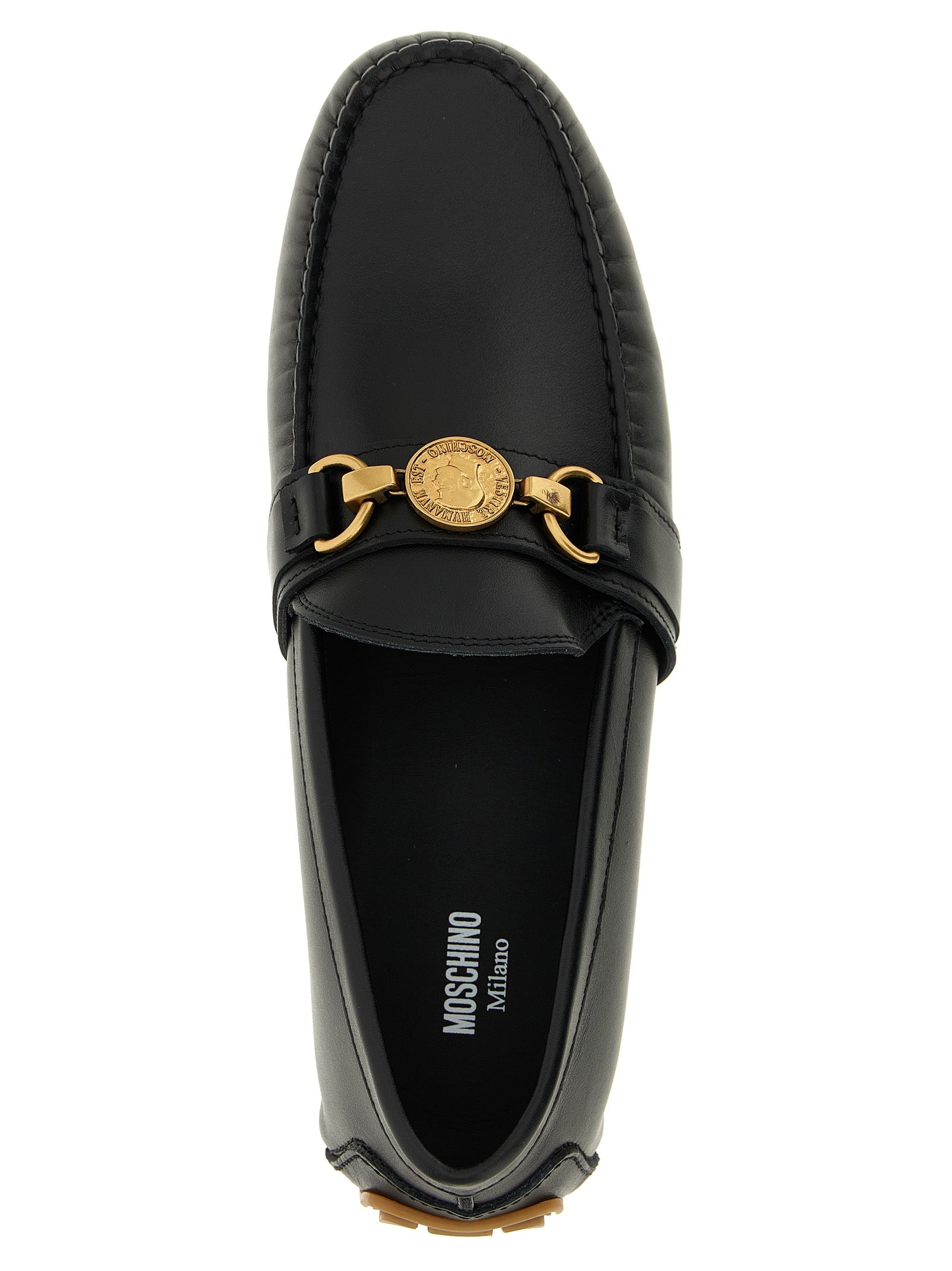 Experience the allure of Moschino Black Leather Slip-On Loafers, where exquisite craftsmanship meets timeless elegance, perfect for the discerning individual.