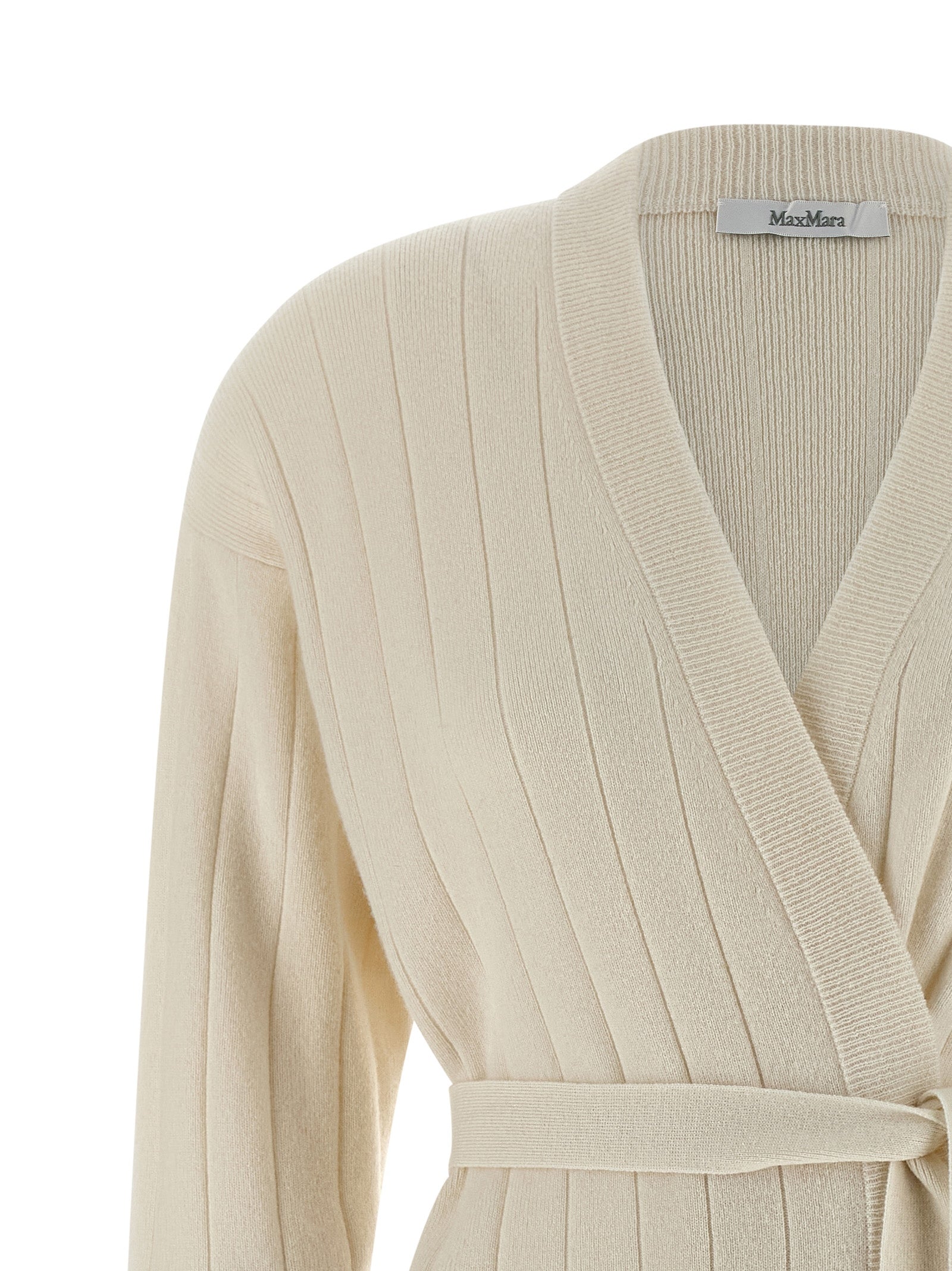 Indulge in the Max Mara White Cashmere Cardigan, a luxurious staple of pure cashmere, exuding timeless elegance and sophistication for any discerning wardrobe.
