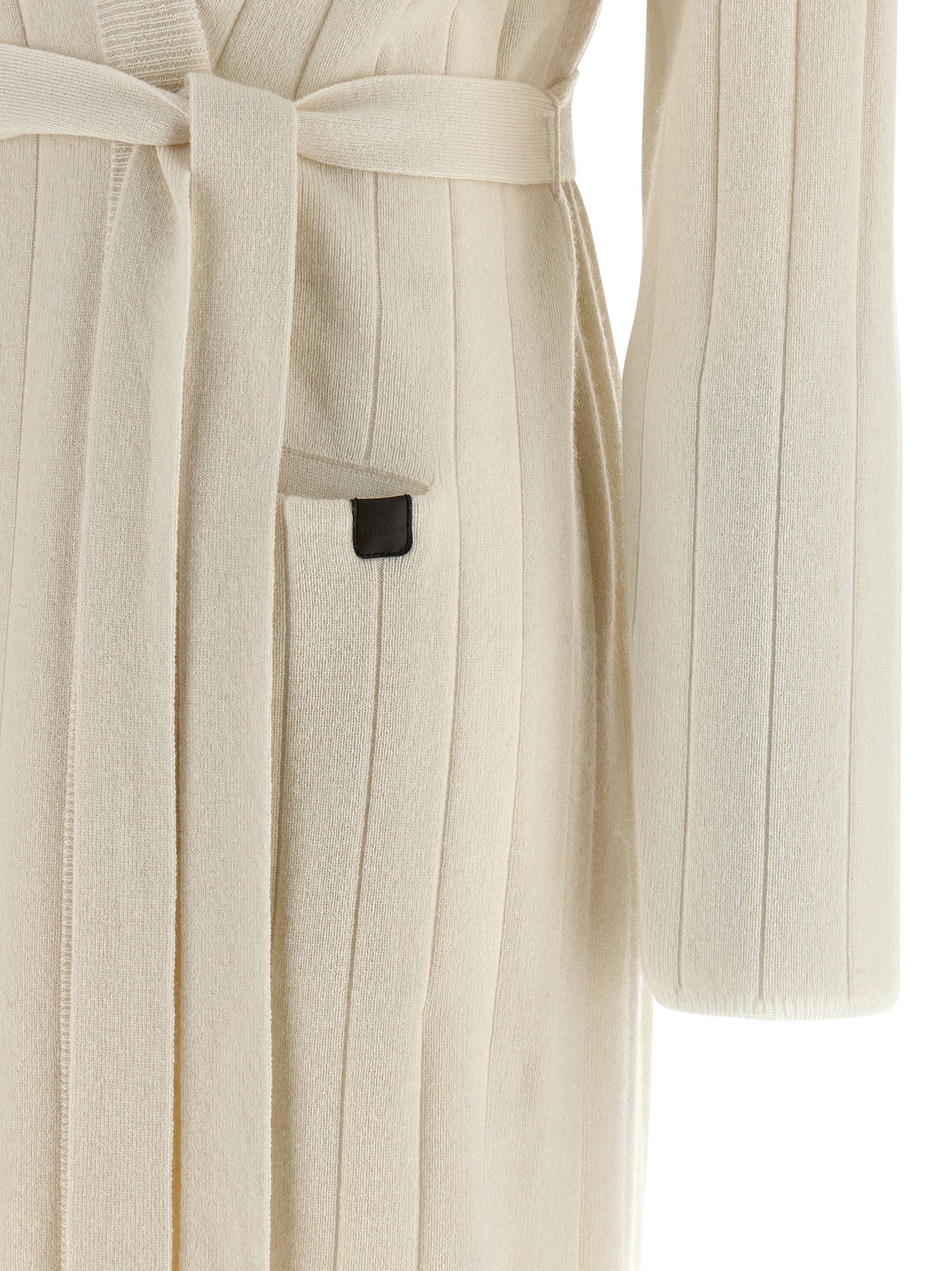 Experience the epitome of luxury with the Max Mara White Cashmere Cardigan, a timeless piece crafted from pure cashmere, perfect for sophisticated elegance.