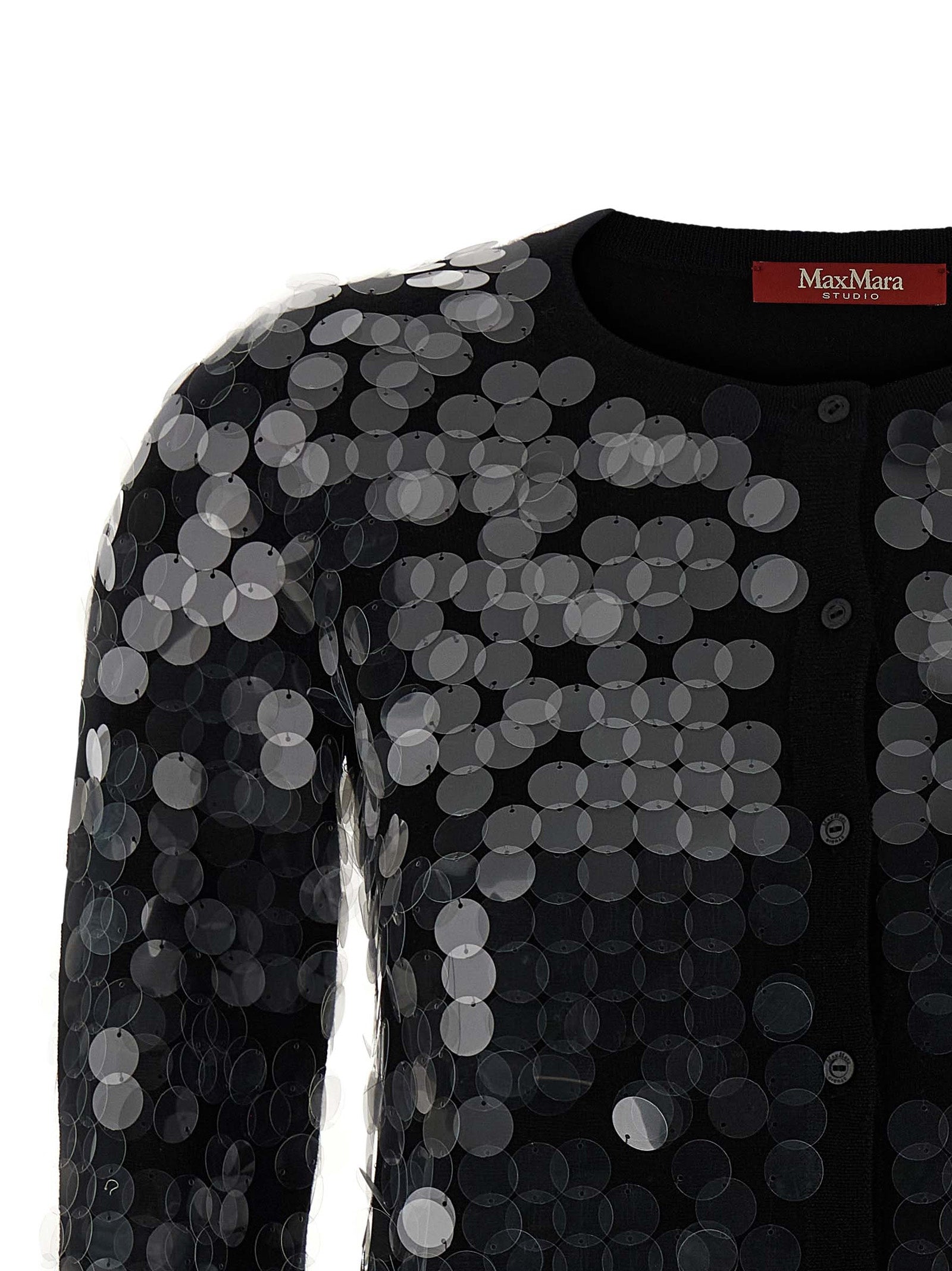 Discover the Max Mara Black Virgin Wool Cardigan, an exquisite blend of luxury and elegance, adorned with macro sequins for a timeless, sophisticated allure.