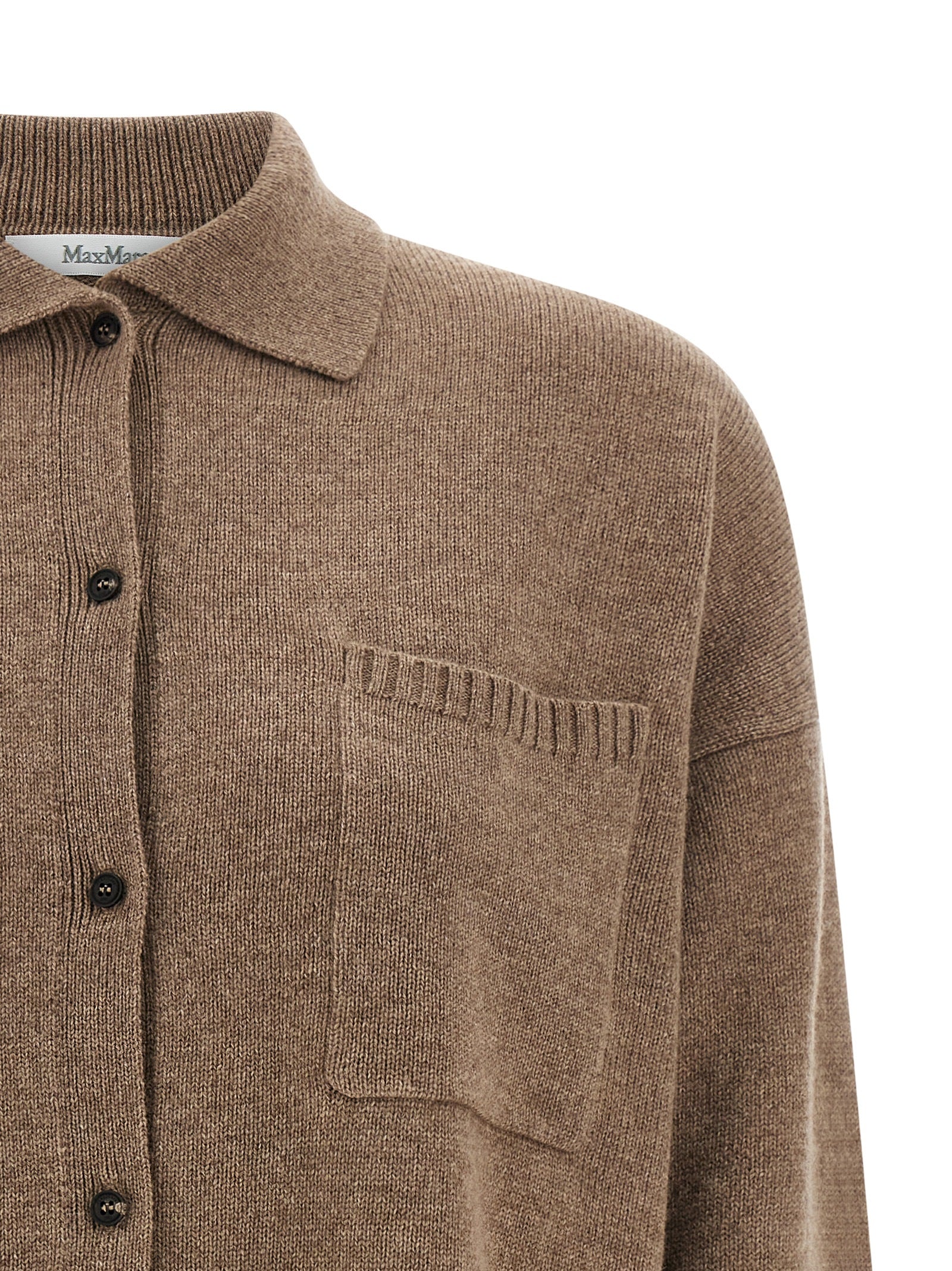 Indulge in the Max Mara Brown Cashmere Cardigan, a masterpiece of artisanal luxury, crafted from the finest cashmere for timeless elegance and unparalleled comfort.