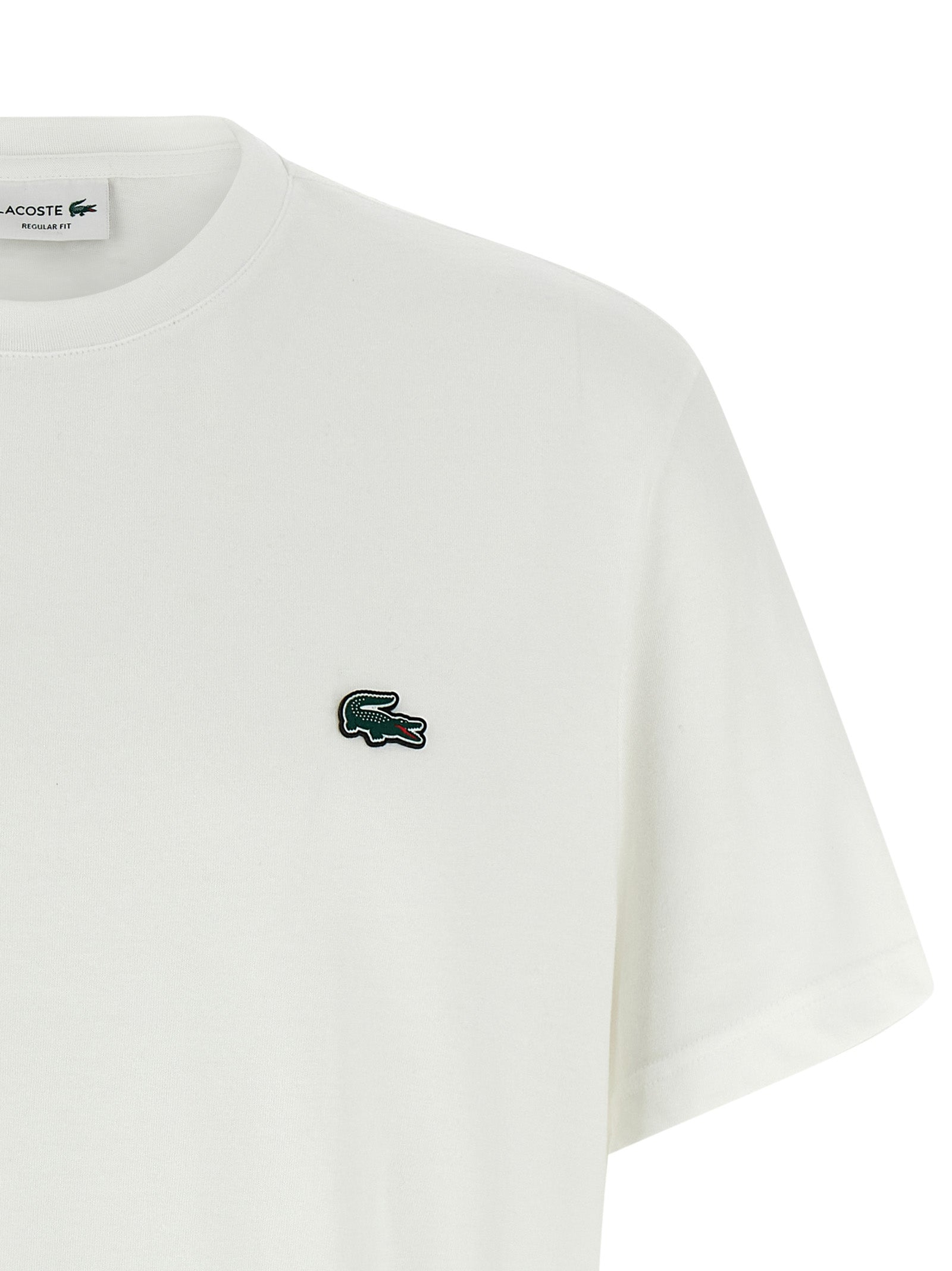 Elevate your wardrobe with the Lacoste White Cotton T-Shirt, a luxurious blend of comfort and sophistication, perfect for the discerning trendsetter.