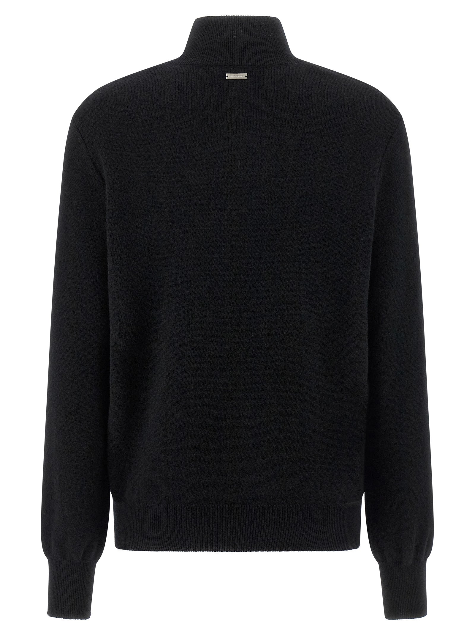 Indulge in the Ferragamo Black Virgin Wool Cardigan, a luxurious blend of virgin wool and cashmere, embodying elegance and sophistication for the discerning fashion connoisseur.