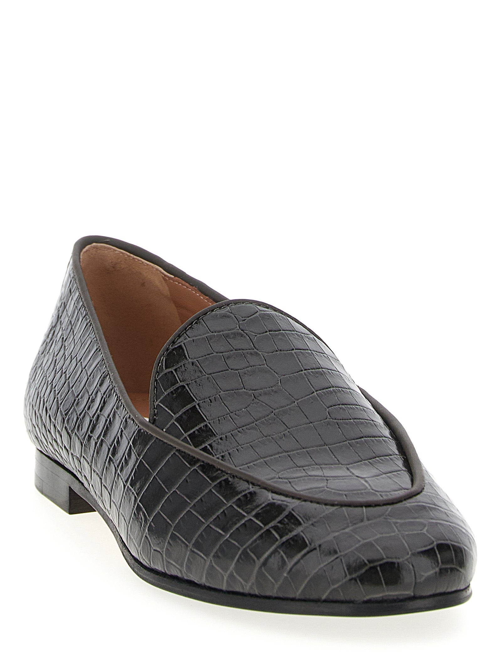 Elevate your style with Aquazzura's Black Calfskin Slip-On Loafers, a fusion of Italian craftsmanship and luxurious comfort, perfect for the discerning individual.