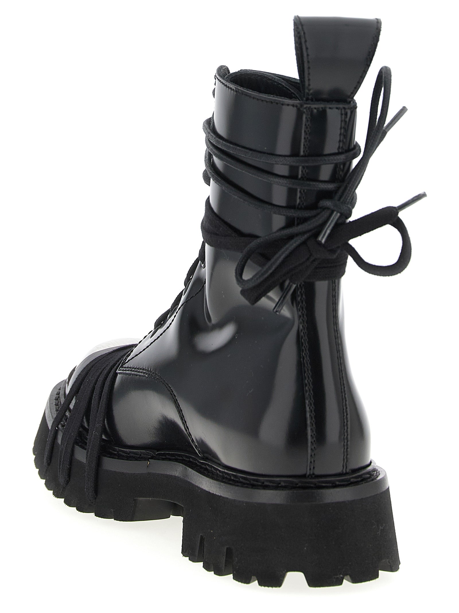 Step into the essence of haute couture with Moschino's Black Calfskin Lace-Up Boots, where luxurious craftsmanship meets timeless elegance for the discerning individual.