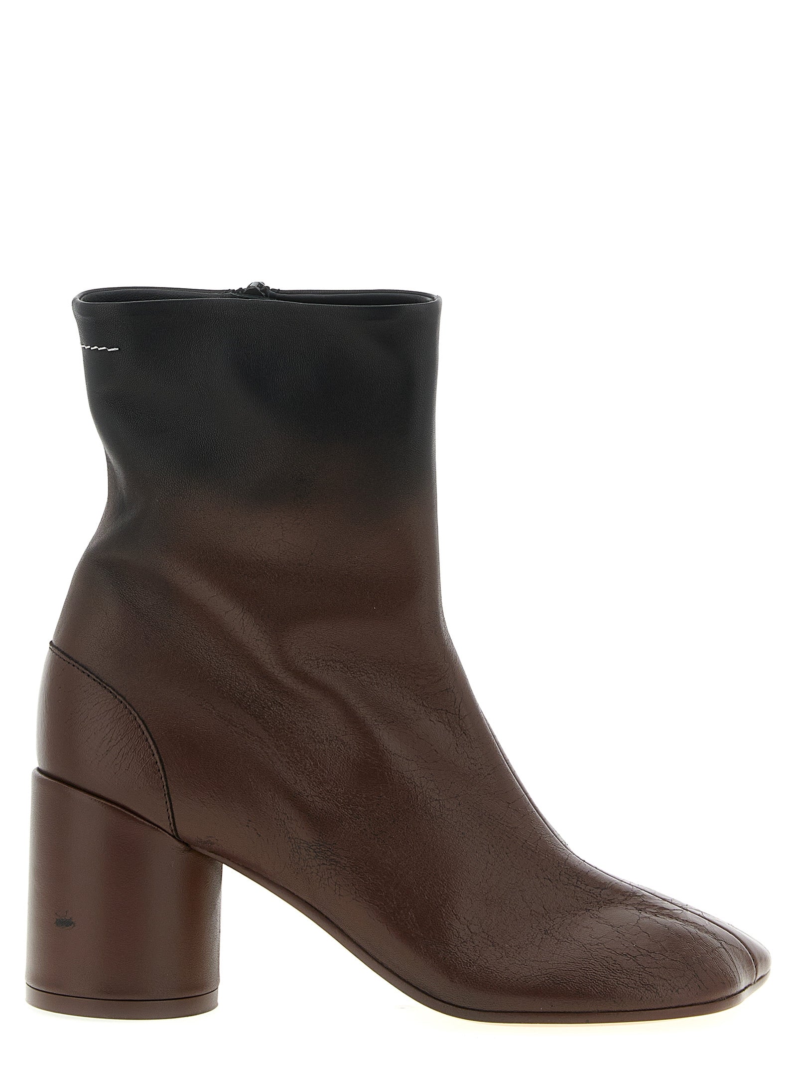 Discover the exquisite MM6 Maison Margiela Brown Lambskin Ankle Boots, where artisanal craftsmanship meets avant-garde design for unparalleled elegance and sophistication.