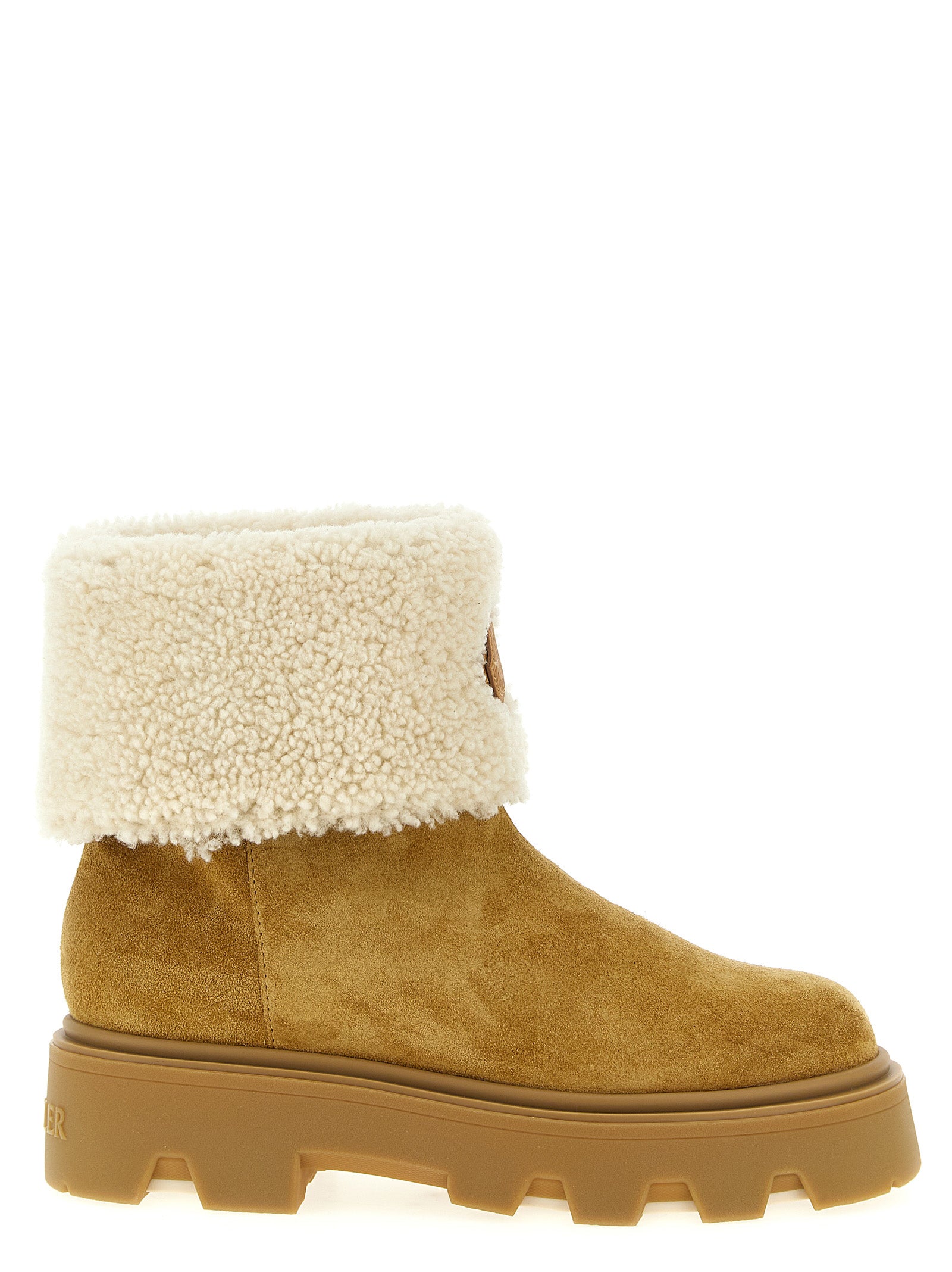 Indulge in the exquisite Moncler Beige Calfskin Ankle Boots, where luxurious shearling meets timeless craftsmanship, elevating your style to unparalleled heights.