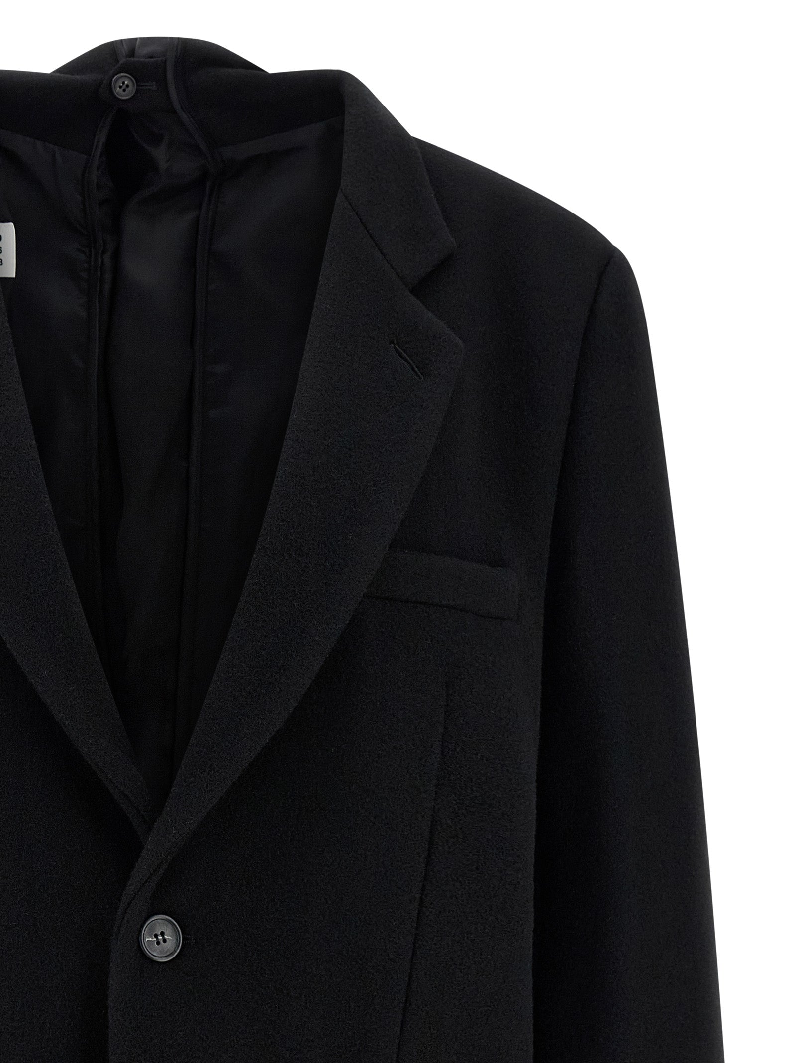 Discover the MM6 Maison Margiela Black Virgin Wool Blazer, a luxurious blend of 80% virgin wool and 20% polyester, embodying elegance and sophistication for the discerning individual.
