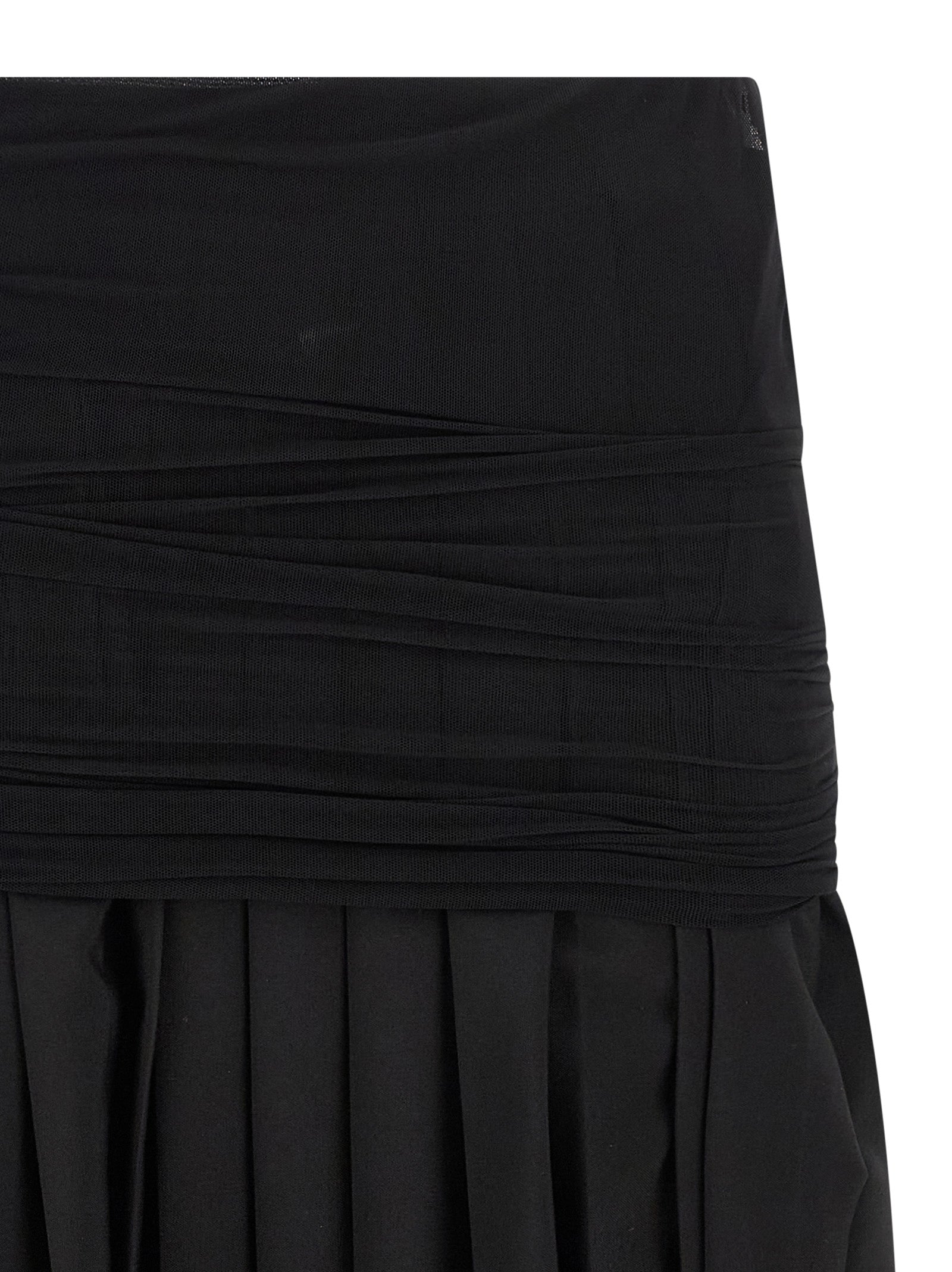 Elevate your style with the MM6 Maison Margiela Black Polyester Midi Skirt, a luxurious blend of sophistication and modernity, crafted for timeless elegance.