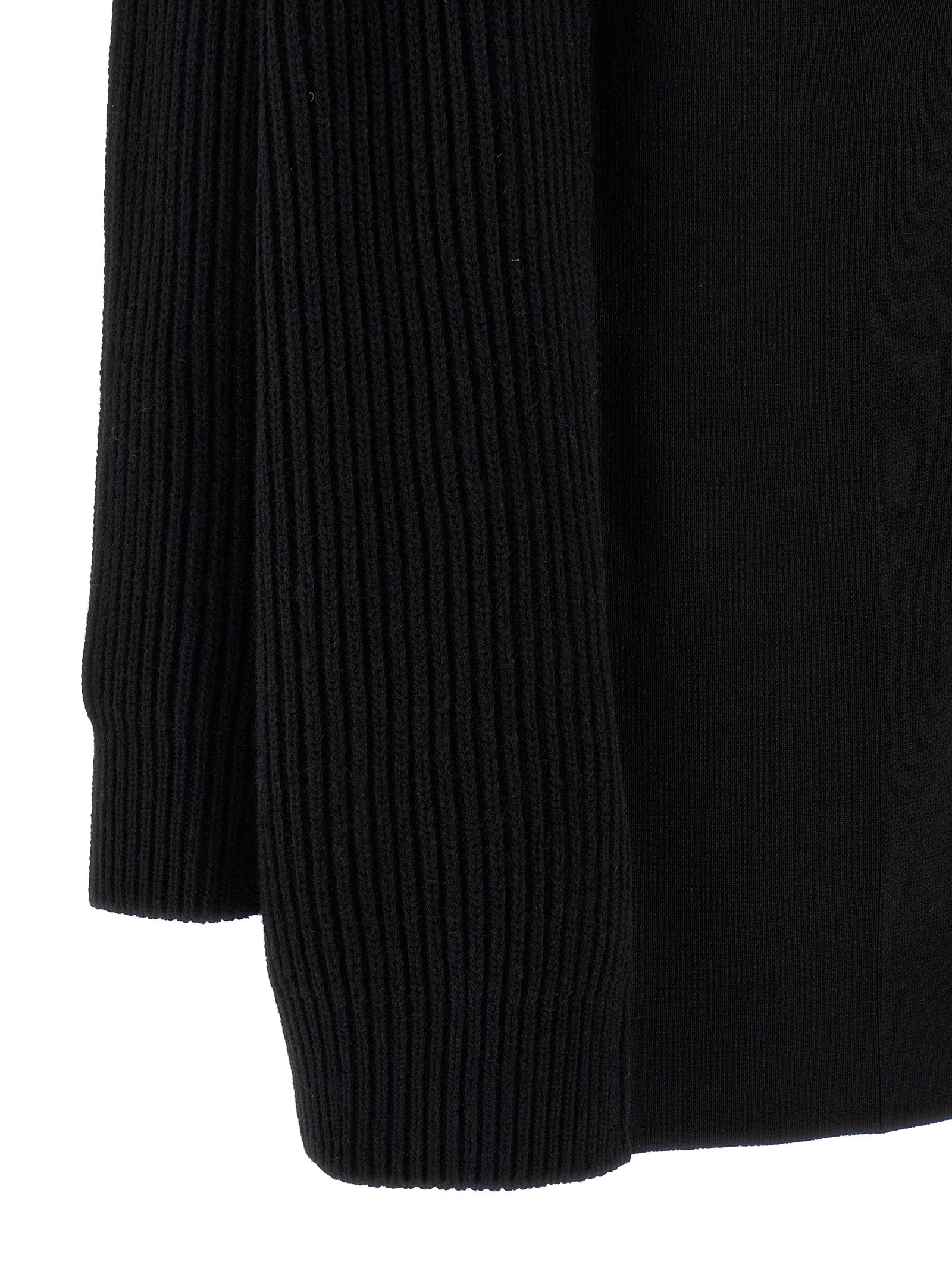 Indulge in the MM6 Maison Margiela Black Wool Short Dress, a masterpiece of luxurious craftsmanship that embodies elegance and sophistication for the discerning fashionista.