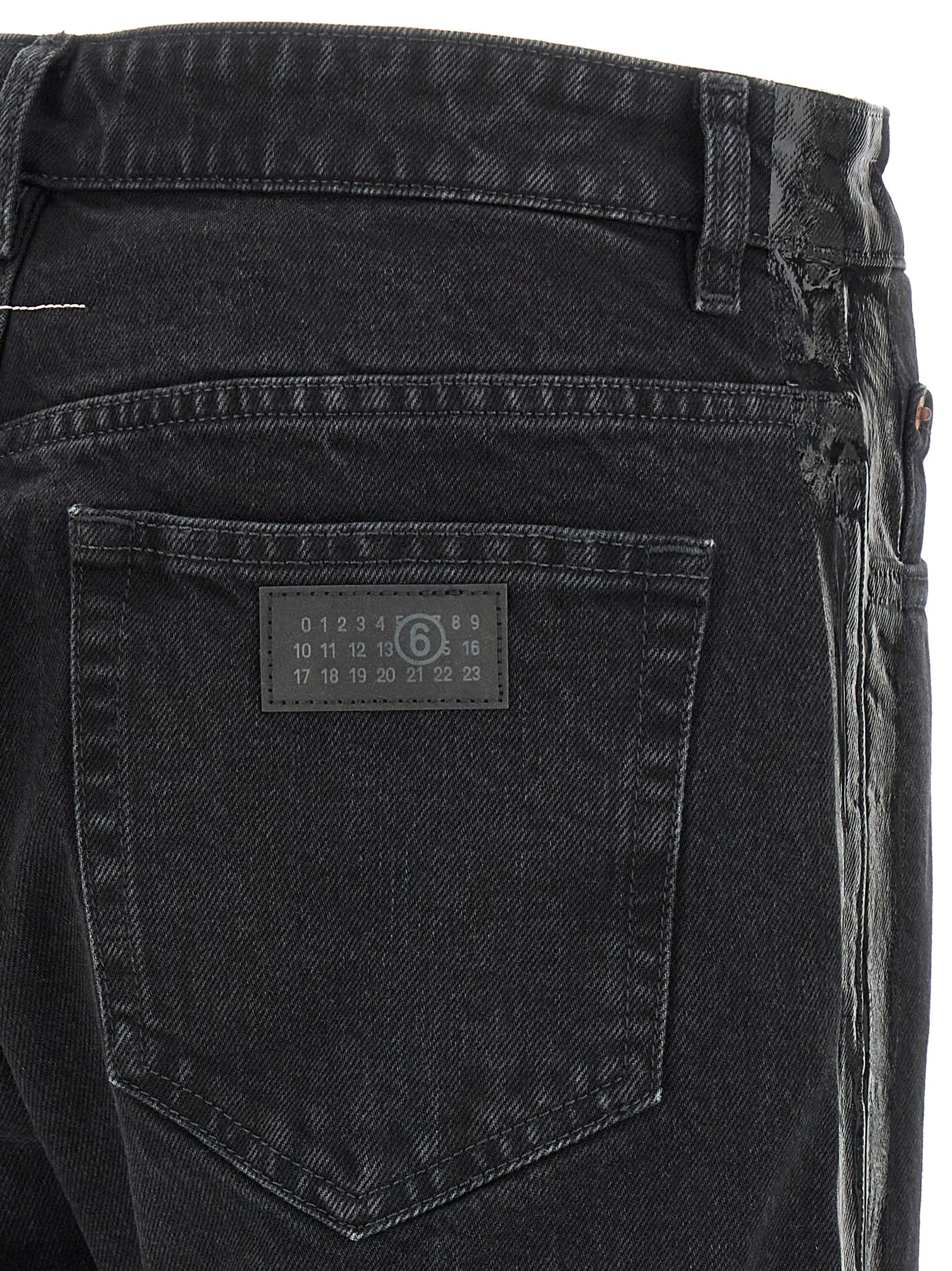 Indulge in the luxurious allure of MM6 Maison Margiela's Black Cotton Tapered Jeans, where avant-garde design meets exquisite craftsmanship for a statement of sophistication.