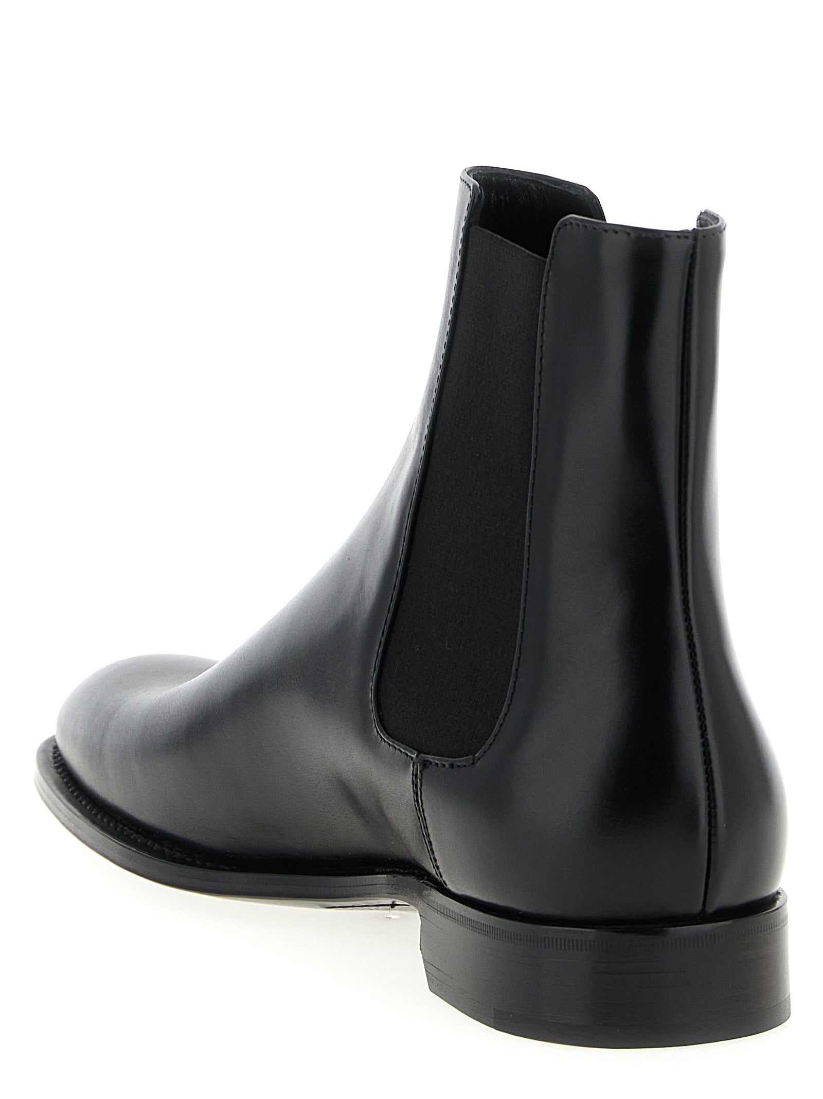 Experience the allure of Saint Laurent's Black Calfskin Chelsea Boots, where exquisite craftsmanship and timeless elegance elevate your style to new heights.