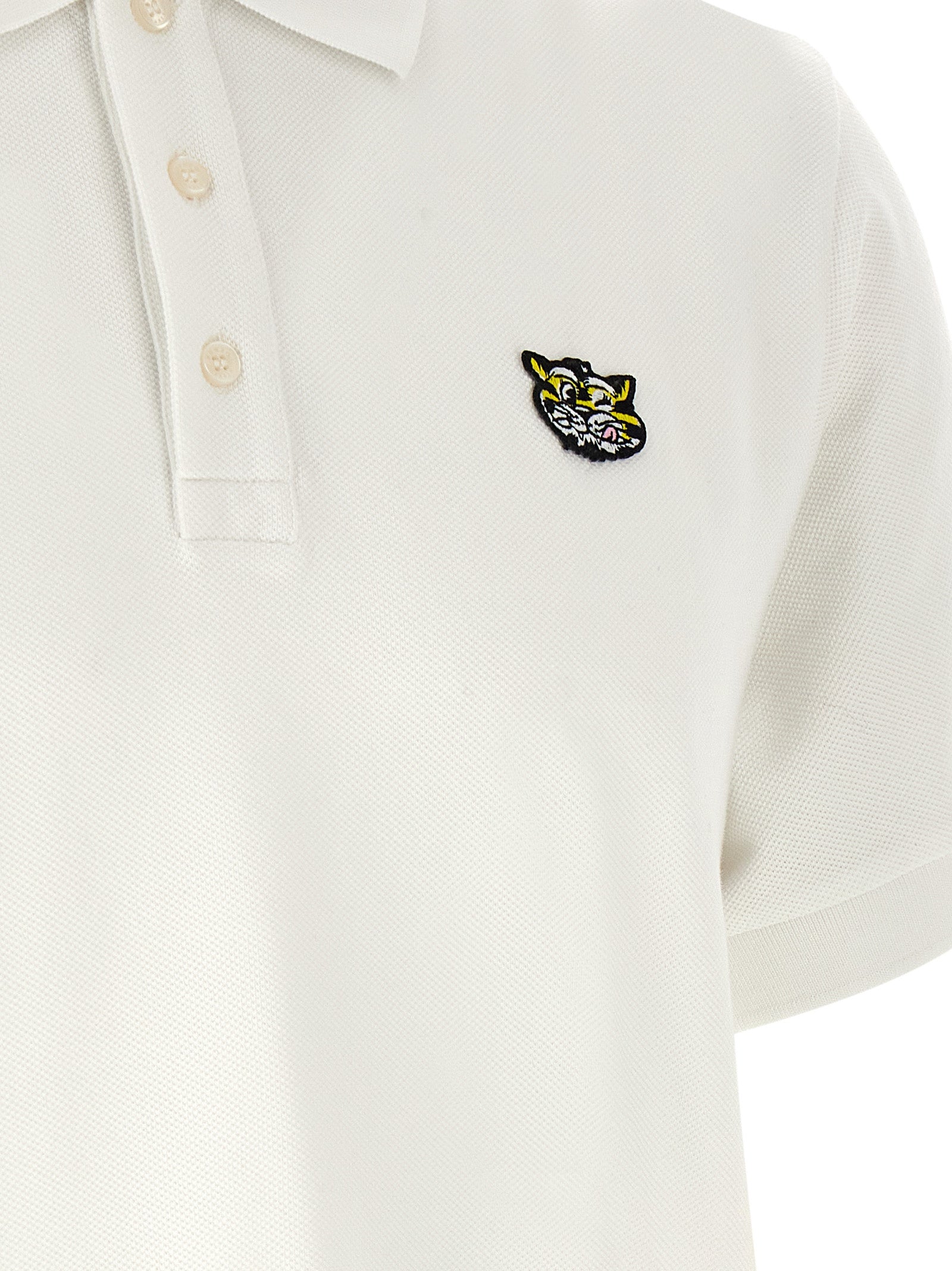 Elevate your style with the Kenzo White Cotton Polo Shirt, a masterpiece of artisanal luxury crafted in Portugal, embodying timeless elegance and bold sophistication.