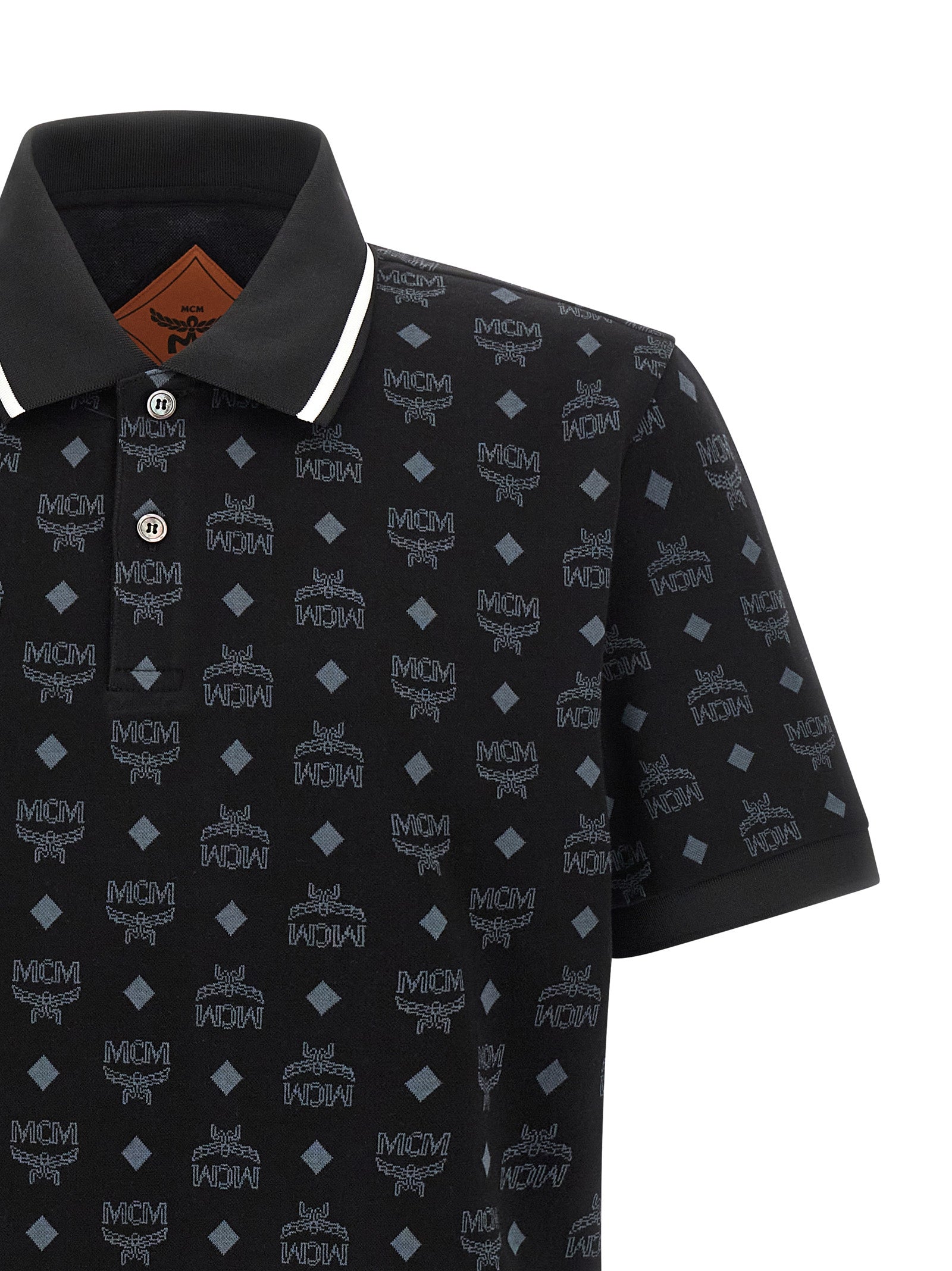 Elevate your wardrobe with the MCM Black Cotton Polo Shirt, a masterpiece of artisanal luxury, crafted from exquisite cotton jacquard for the discerning individual.