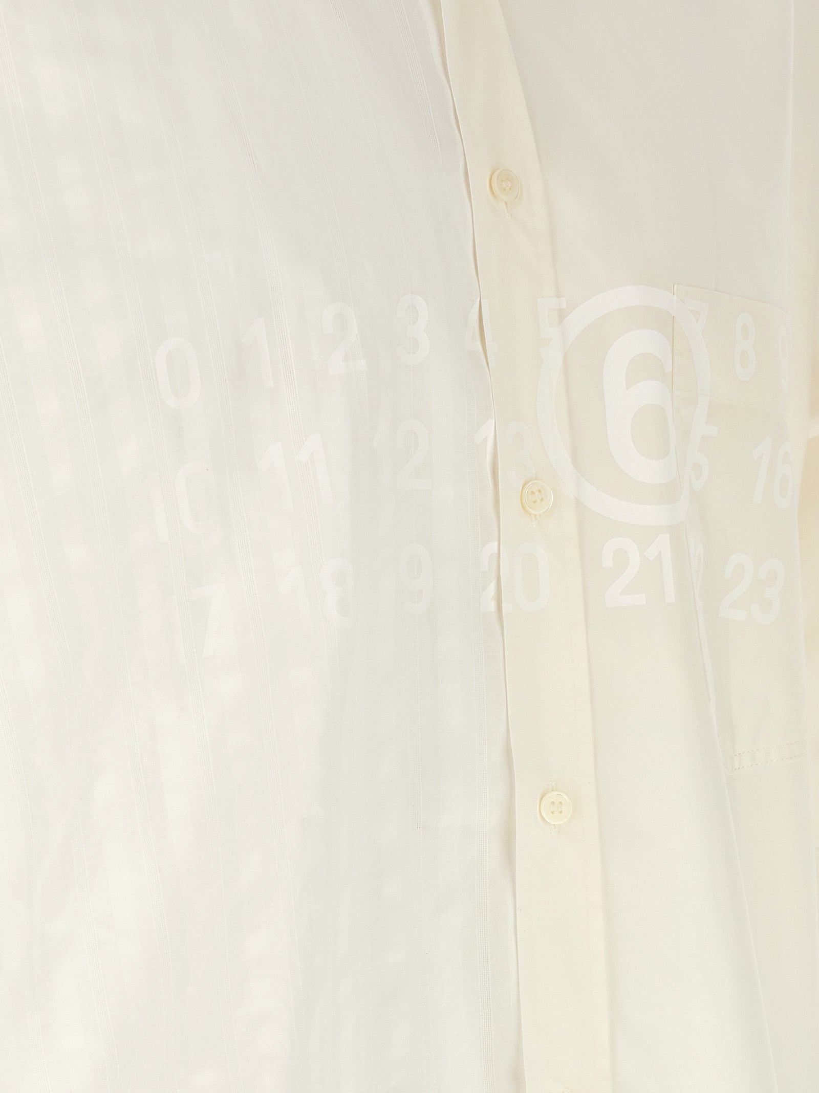 Discover the MM6 Maison Margiela White Cotton Blouse, a masterpiece of Italian craftsmanship that embodies elegance and avant-garde allure for the discerning individual.