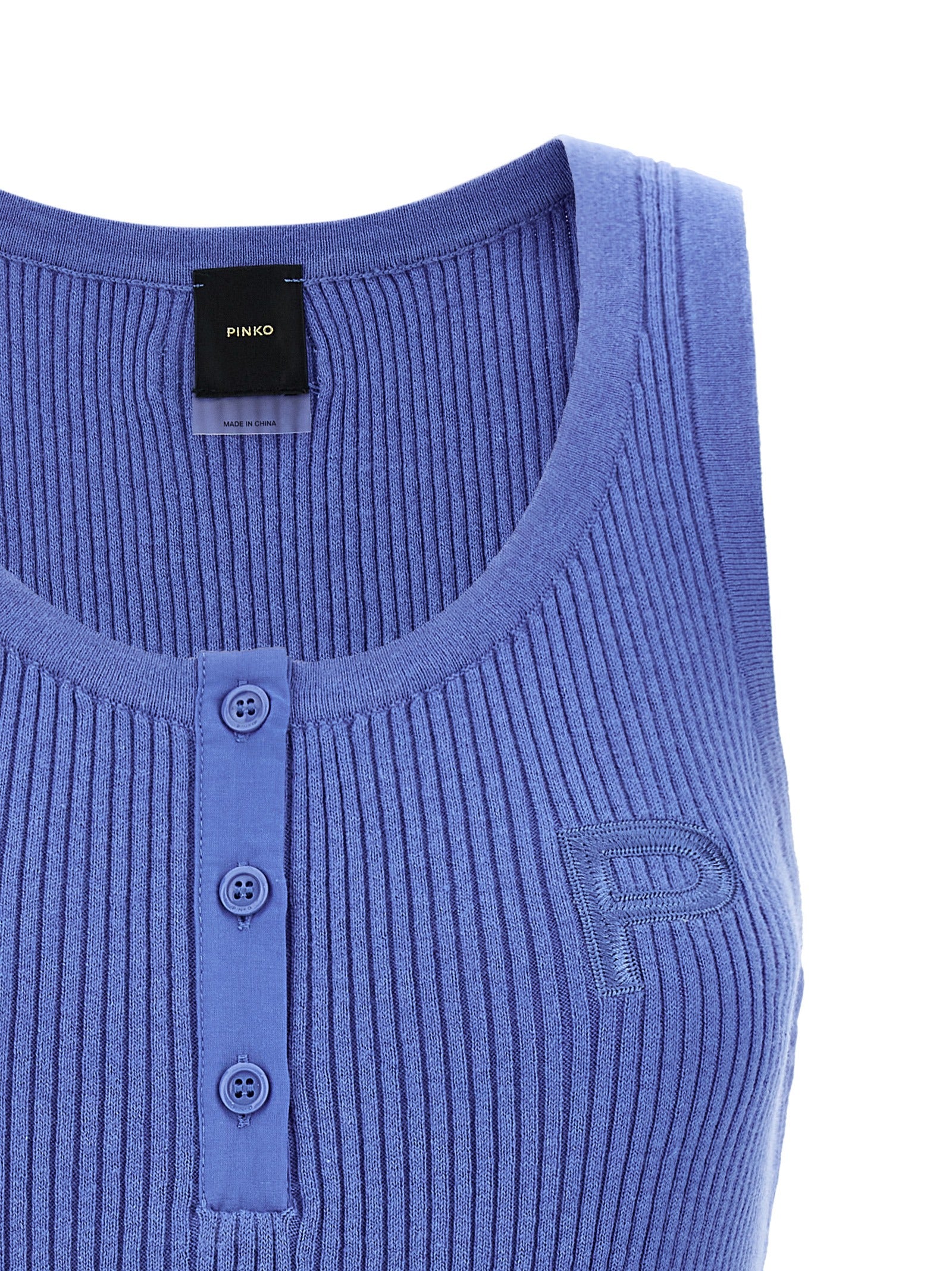 Discover the PINKO Sisma tank top, a luxurious blend of cotton and cashmere, epitomizing refined elegance and timeless style for the discerning wardrobe.