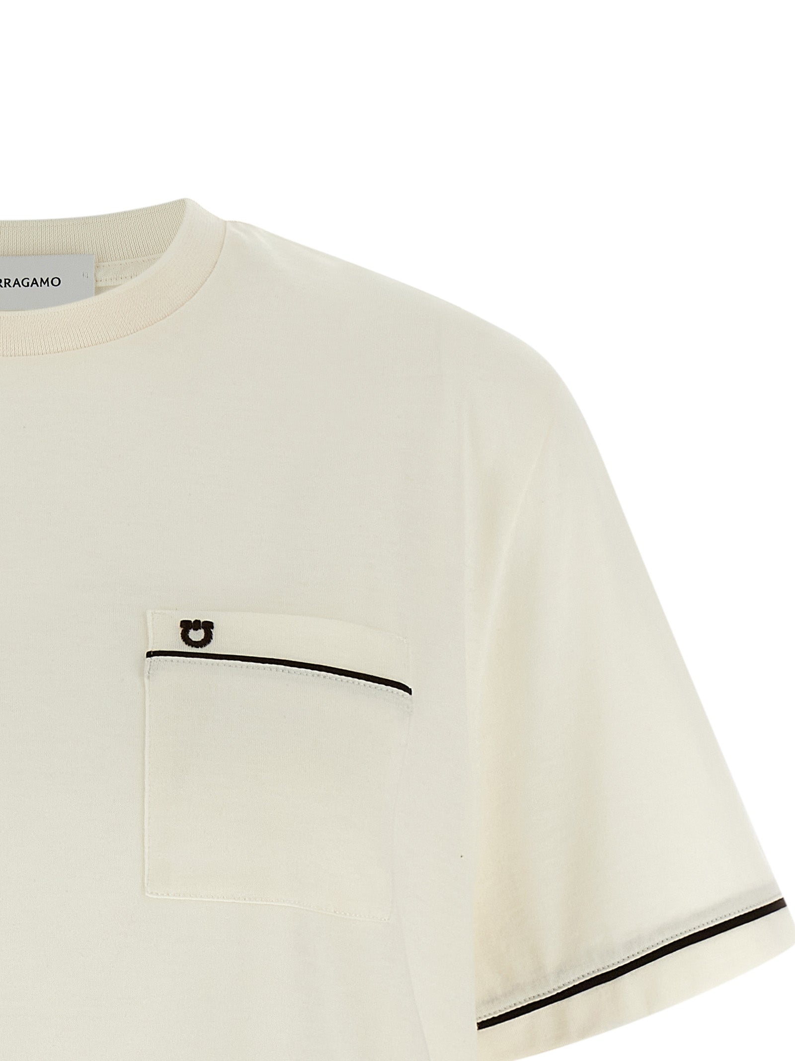 Experience the essence of Italian elegance with the Ferragamo Beige Cotton T-Shirt, a luxurious blend of cotton and cashmere that redefines sophistication.