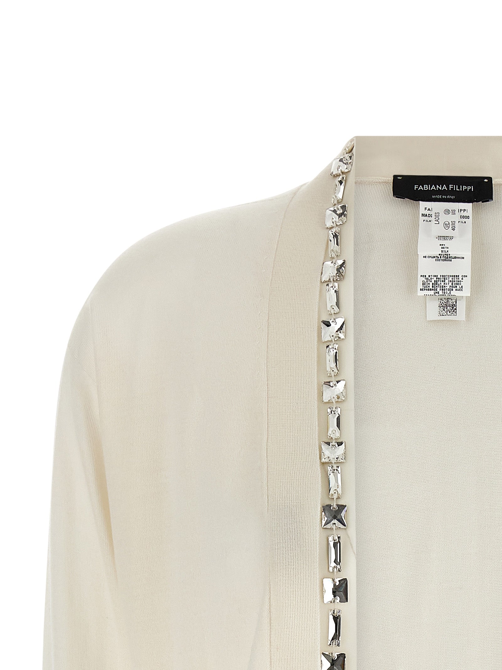 Experience the allure of the Fabiana Filippi White Cashmere Cardigan, a luxurious blend of cashmere and silk, epitomizing timeless elegance and refined sophistication.