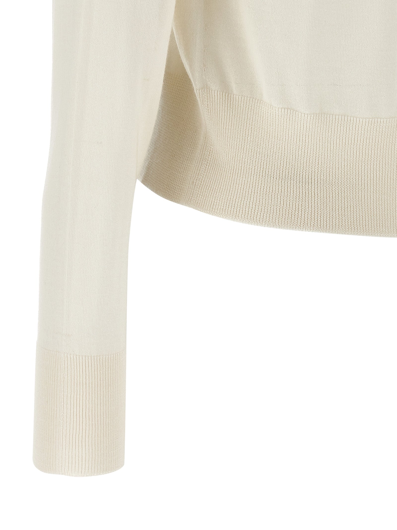 Experience the allure of the Fabiana Filippi White Cashmere Cardigan, a luxurious blend of cashmere and silk, embodying timeless elegance and sophisticated craftsmanship.