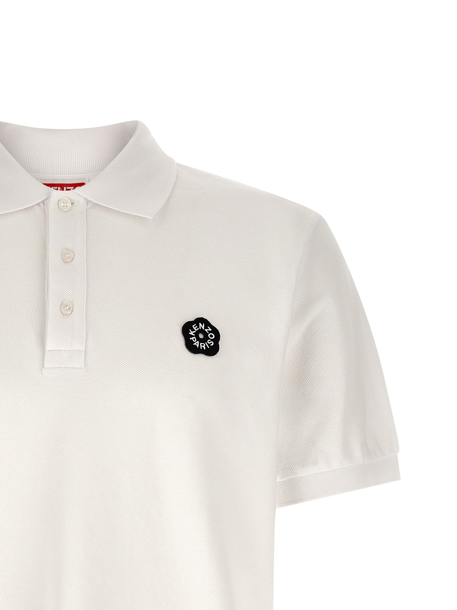 Indulge in the Kenzo White Cotton Polo Shirt, a masterpiece of artisanal luxury crafted from 100% cotton, perfect for elevating any sophisticated wardrobe.