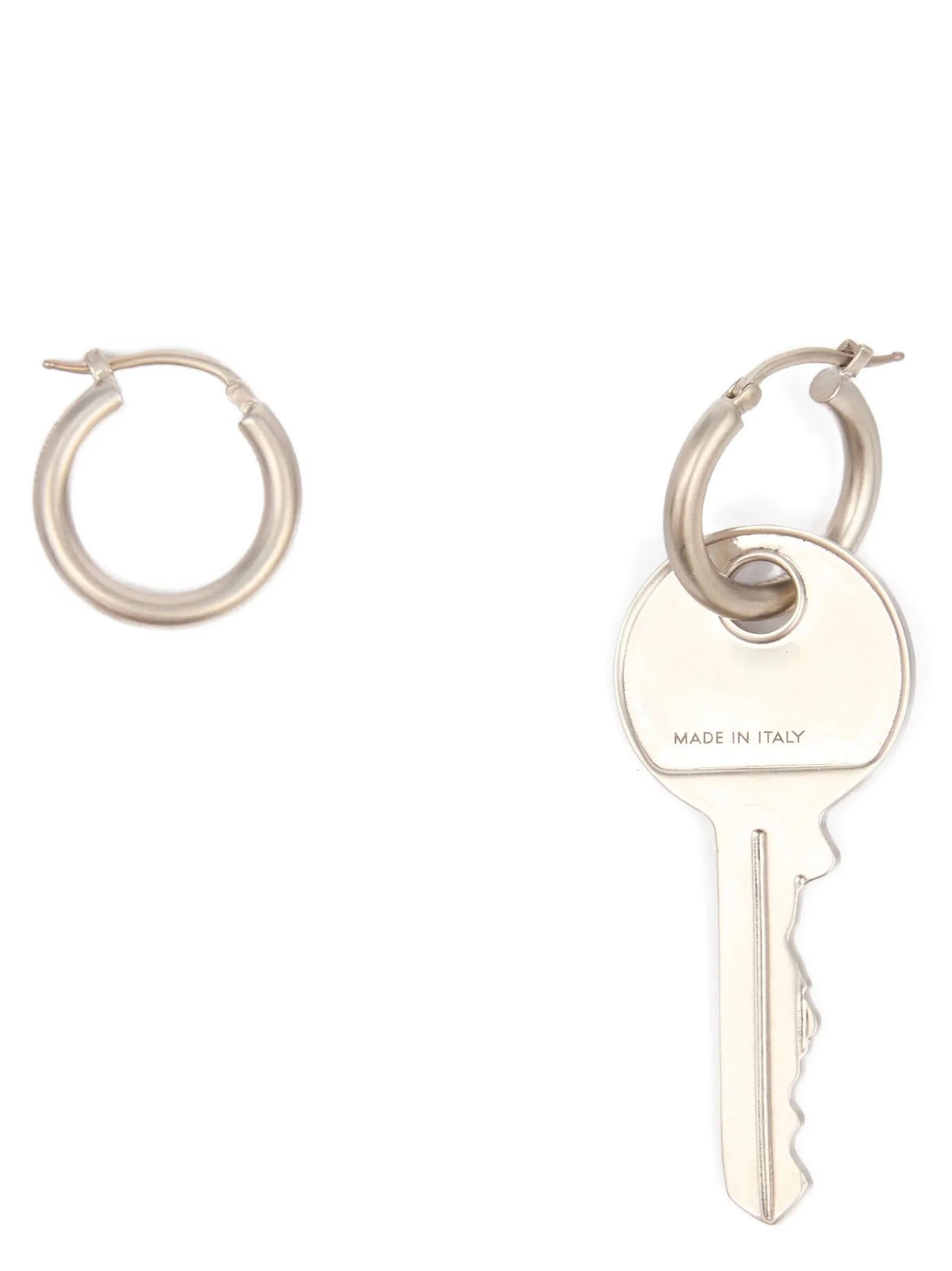 Discover the exquisite MM6 Maison Margiela Silver Brass Earrings, a luxurious statement of artistry and elegance, perfect for those who embrace individuality and sophistication.