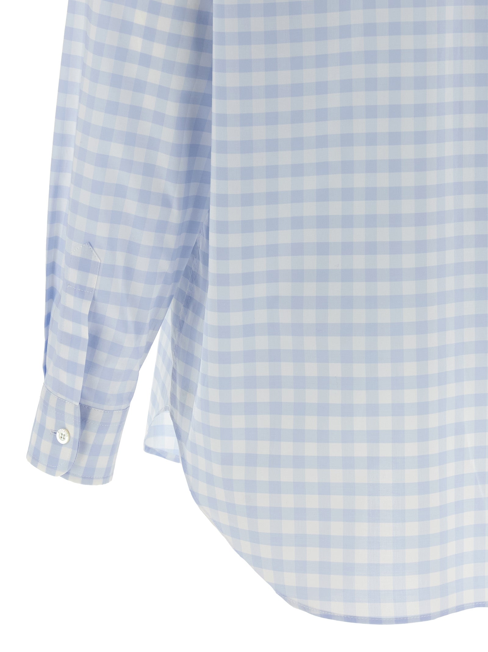 Discover the Moschino Blue Cotton Blouse, a masterpiece of Italian craftsmanship featuring a delicate micro vichy pattern and heart patch, perfect for elevating your style.
