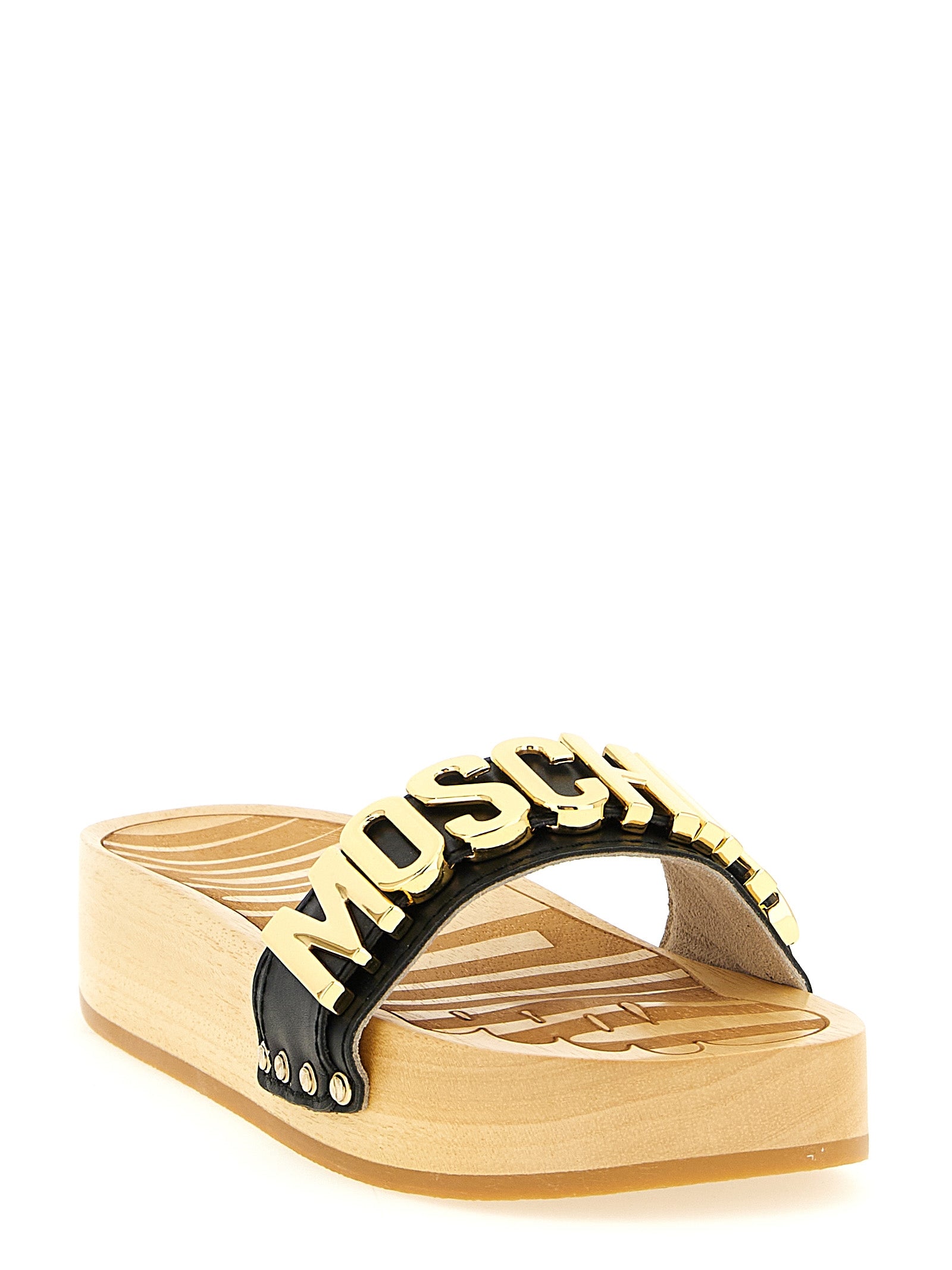 Discover the Moschino Black Calfskin Slides, where exquisite craftsmanship meets bold design, elevating your style with luxurious comfort and timeless elegance.