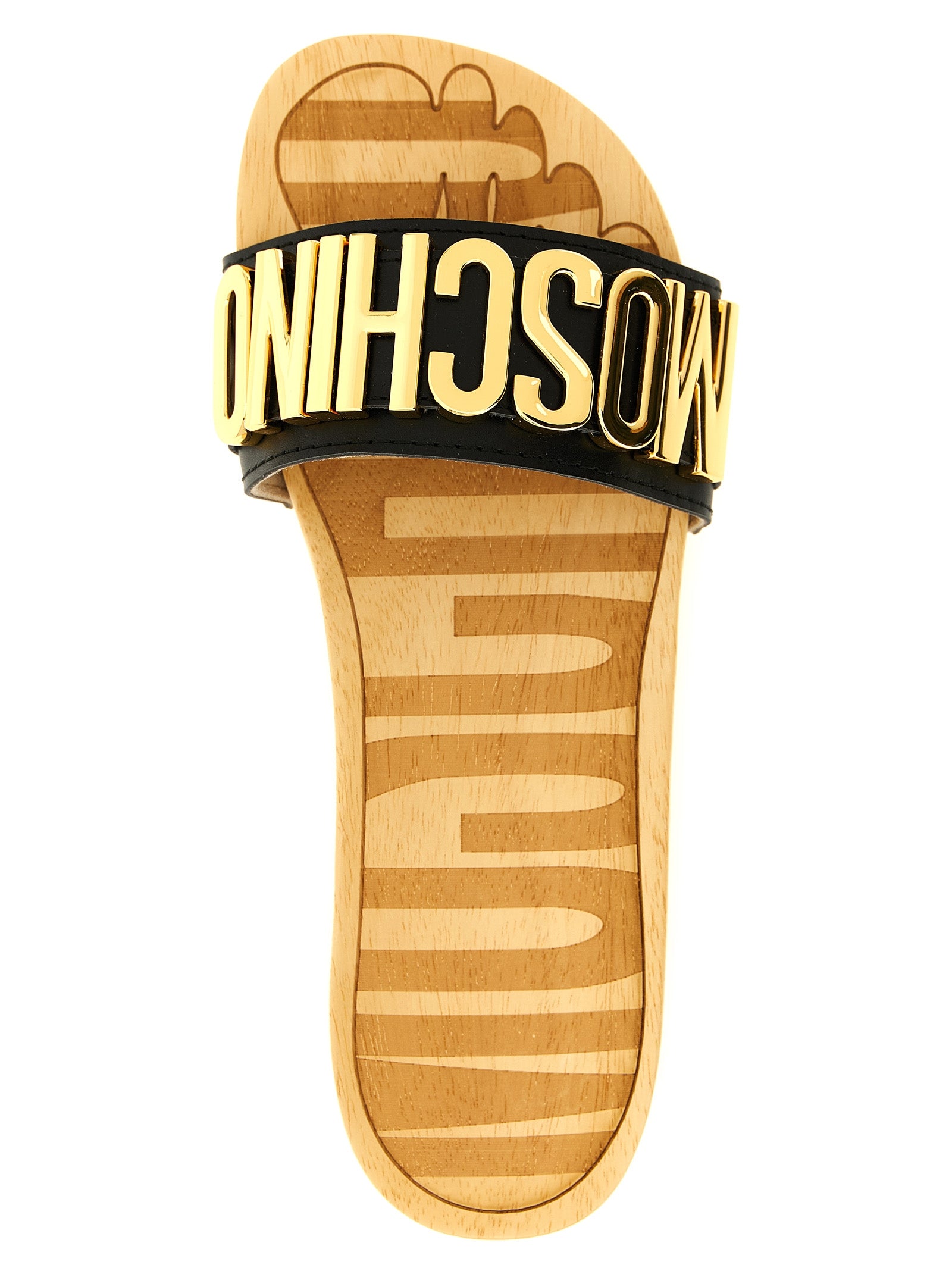 Elevate your style with Moschino Black Calfskin Slides, crafted from luxurious calfskin leather, merging comfort and sophistication for the discerning individual.
