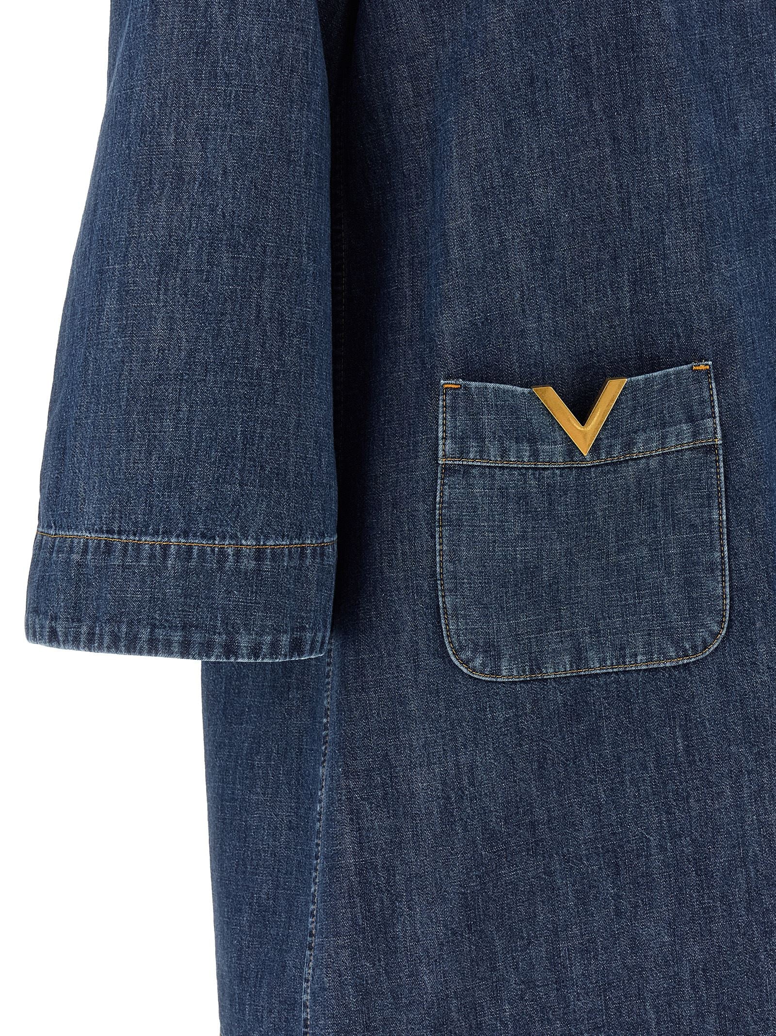 Elevate your wardrobe with the Valentino Garavani Blue Cotton Short Dress, a masterpiece of Italian craftsmanship that embodies luxury and sophistication for every occasion.