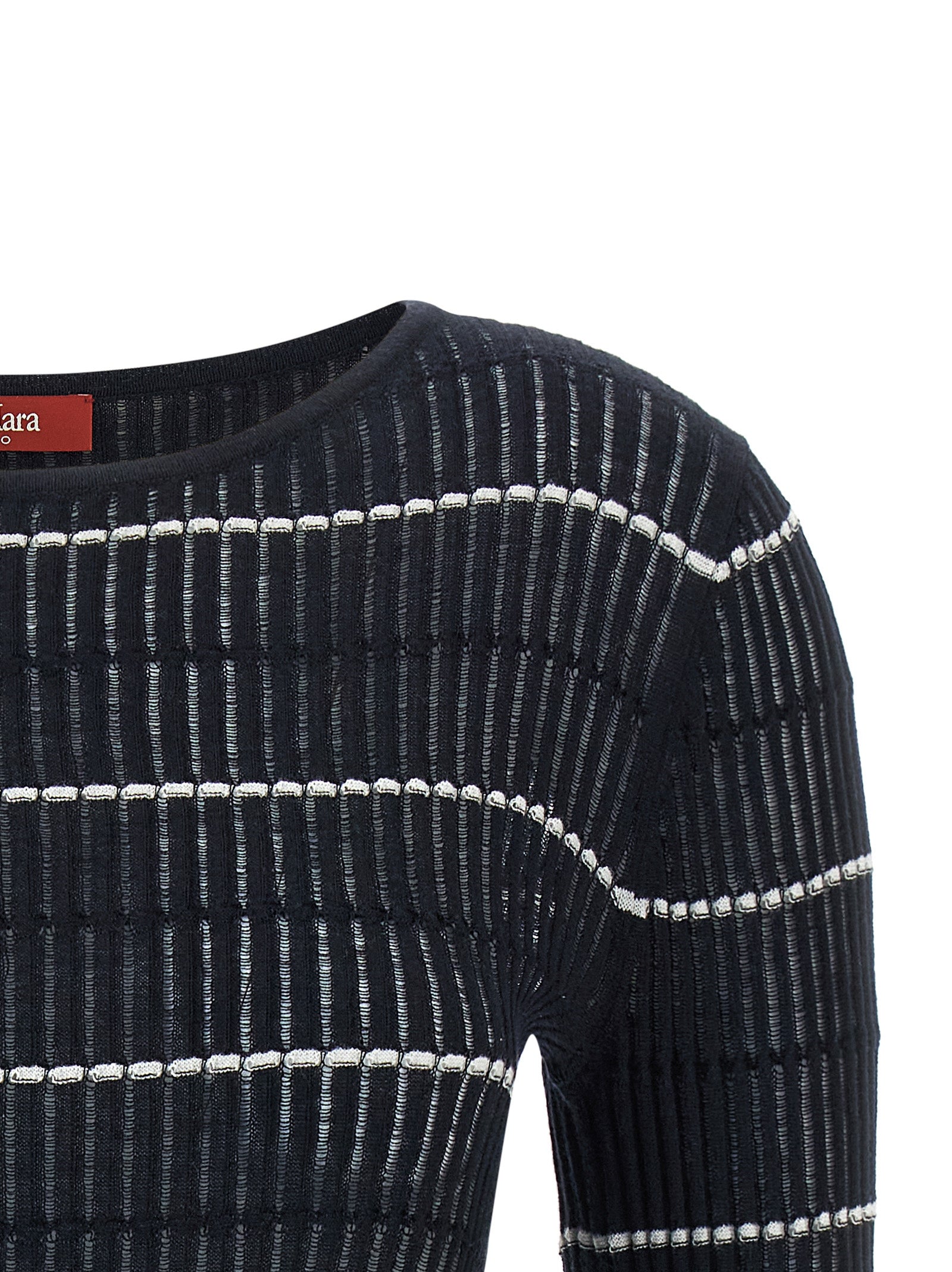 Indulge in the Max Mara Blue Silk Cardigan, a luxurious blend of silk and wool, crafted with artisanal finesse for timeless elegance and modern sophistication.