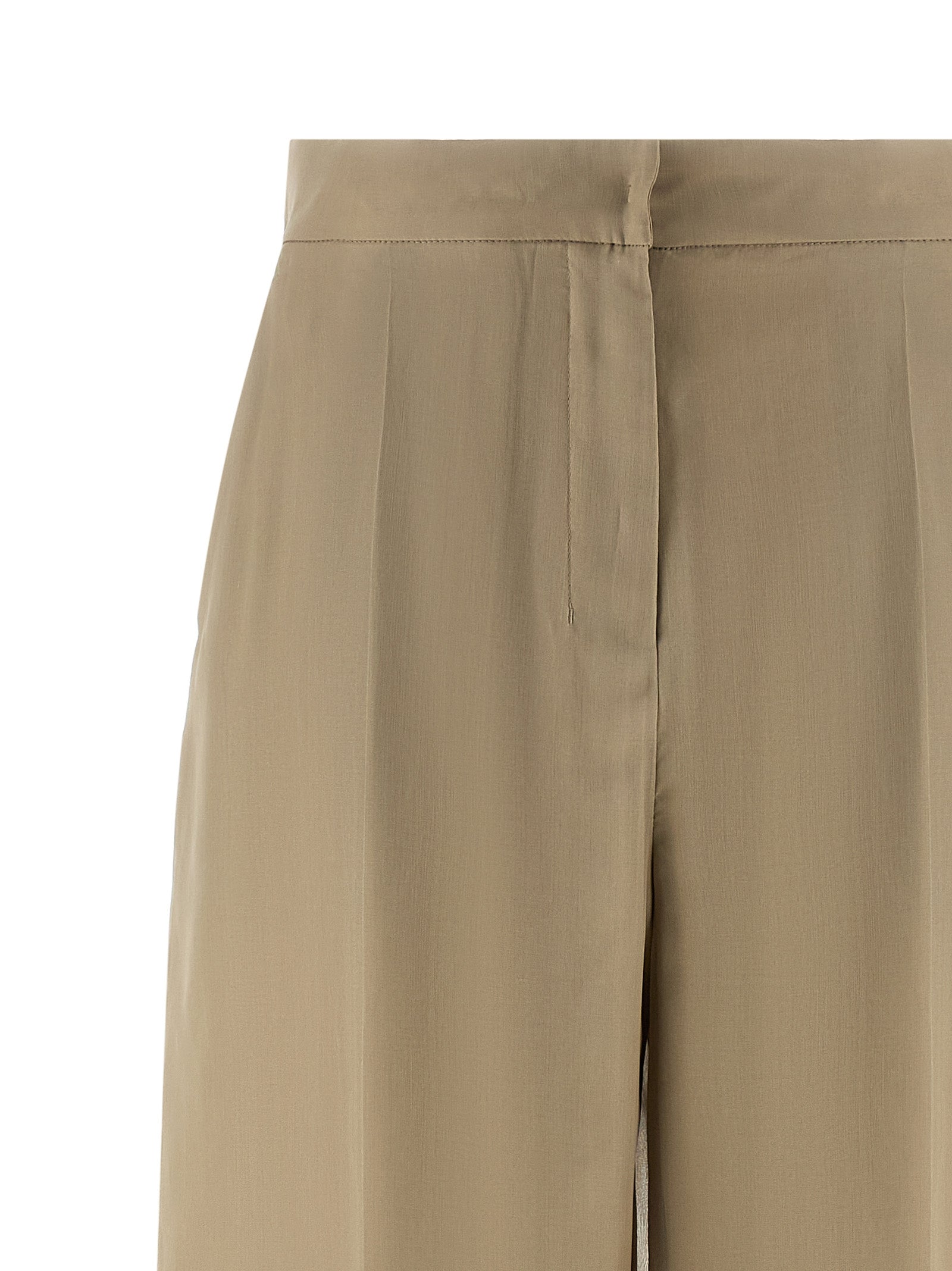 Discover the elegance of Max Mara's beige silk casual pants, a masterpiece of Italian craftsmanship that embodies timeless luxury and sophisticated allure.