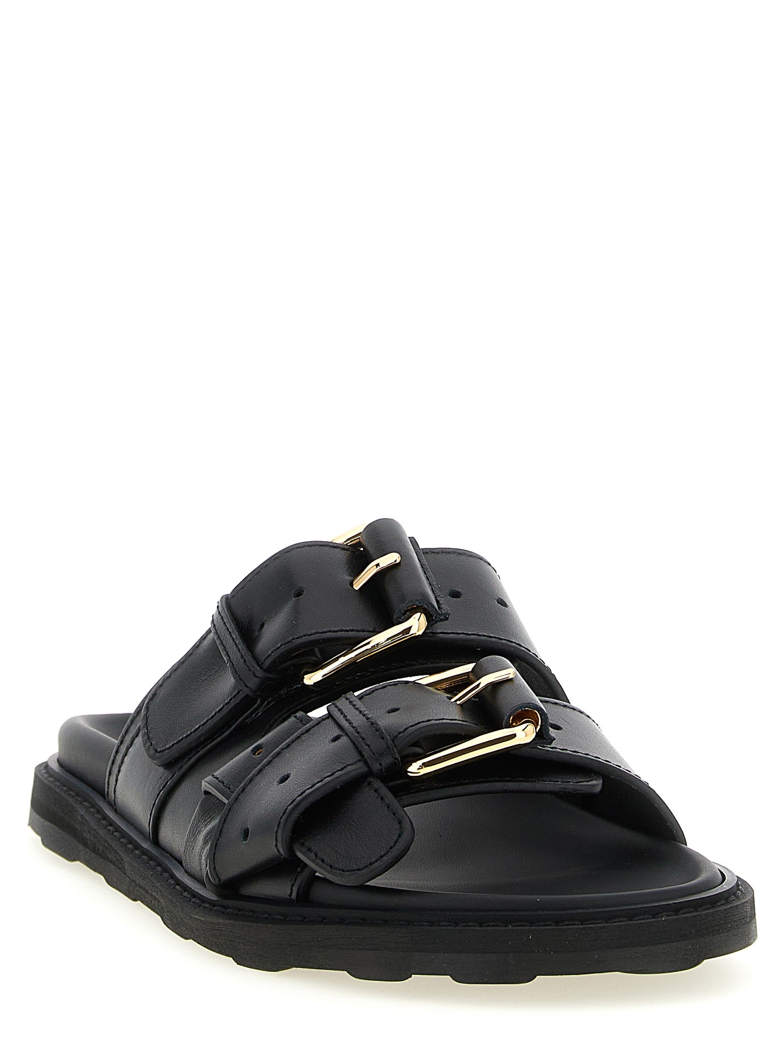 Indulge in the exquisite Moschino Black Calfskin Slides, where artisanal craftsmanship meets luxurious comfort, perfect for elevating your style with timeless sophistication.