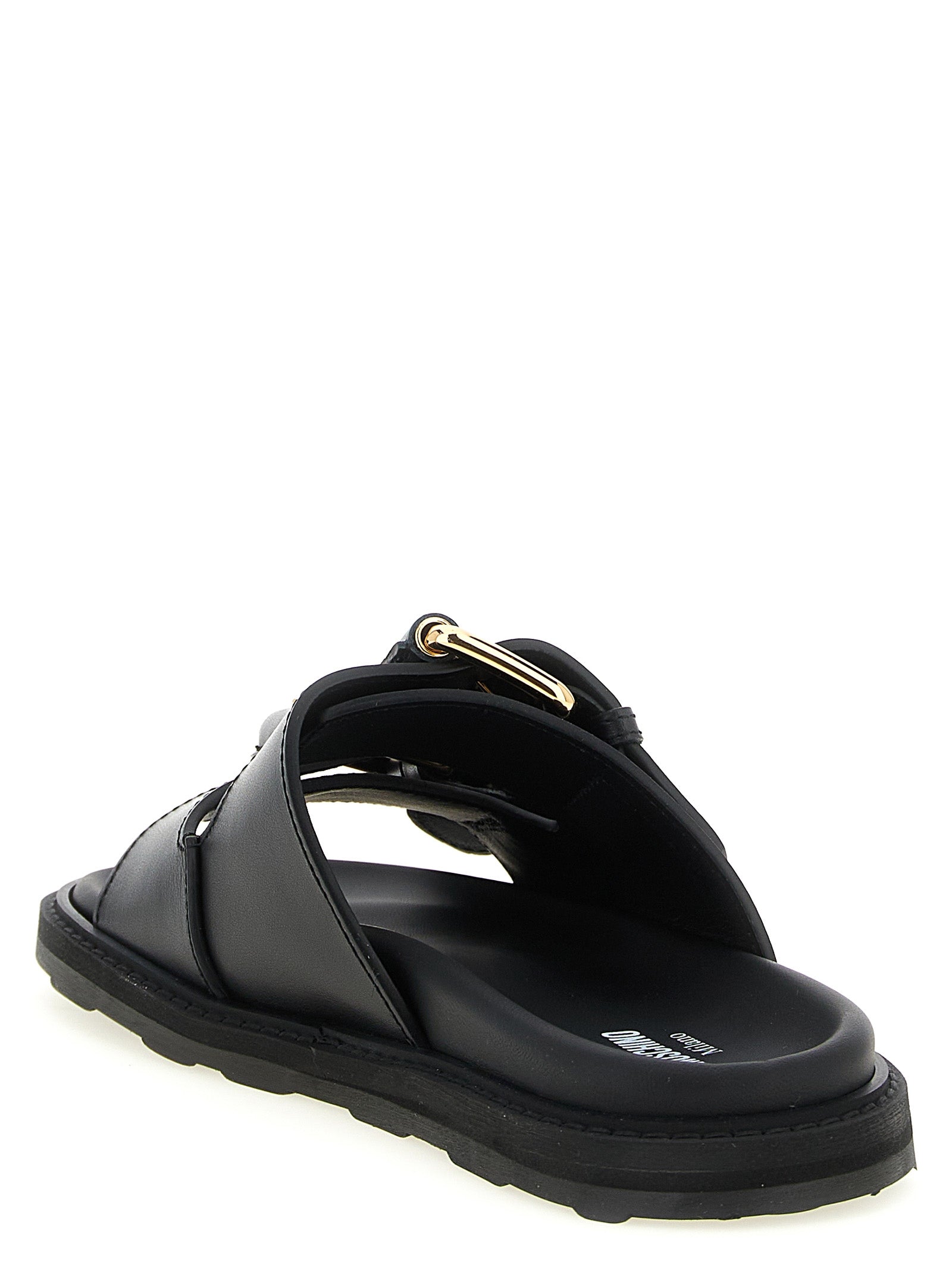 Indulge in the exquisite Moschino Black Calfskin Slides, where artisanal craftsmanship meets luxurious comfort, perfect for elevating any sophisticated ensemble.