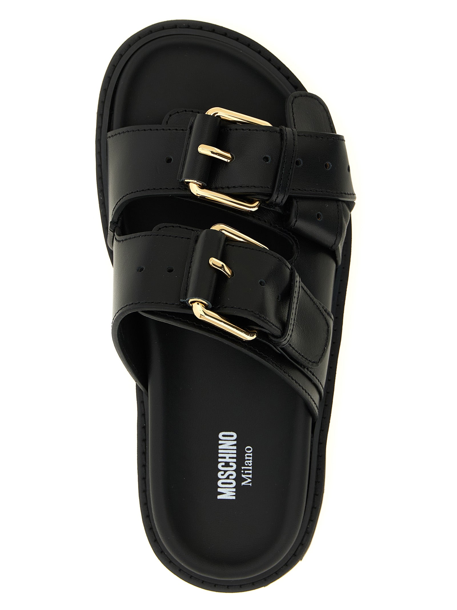Indulge in the exquisite Moschino Black Calfskin Slides, where artisanal craftsmanship meets luxurious comfort, perfect for elevating any sophisticated ensemble.