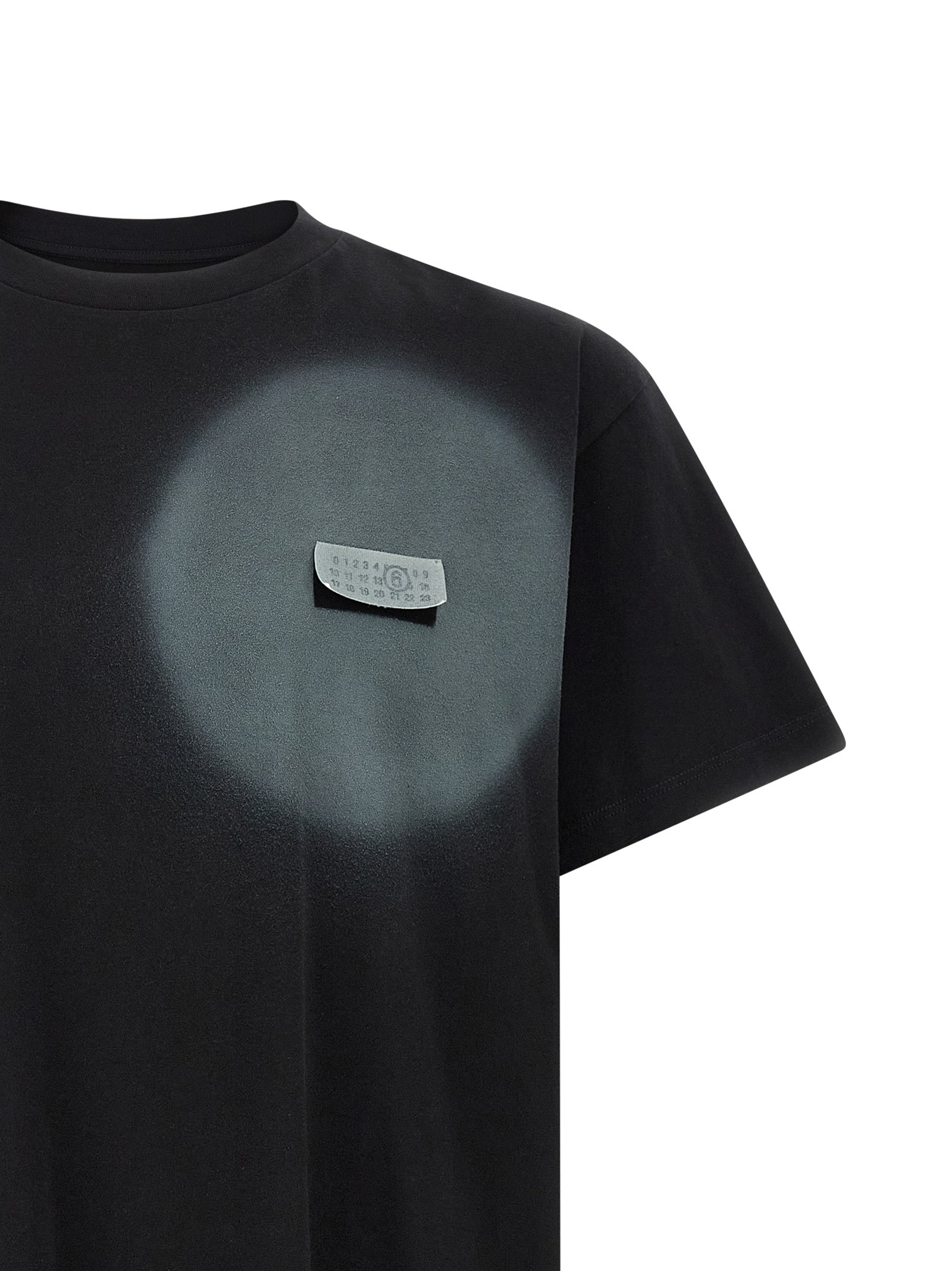 Elevate your wardrobe with the MM6 Maison Margiela Black Cotton T-Shirt, a luxurious blend of contemporary artistry and relaxed sophistication, crafted in Italy.