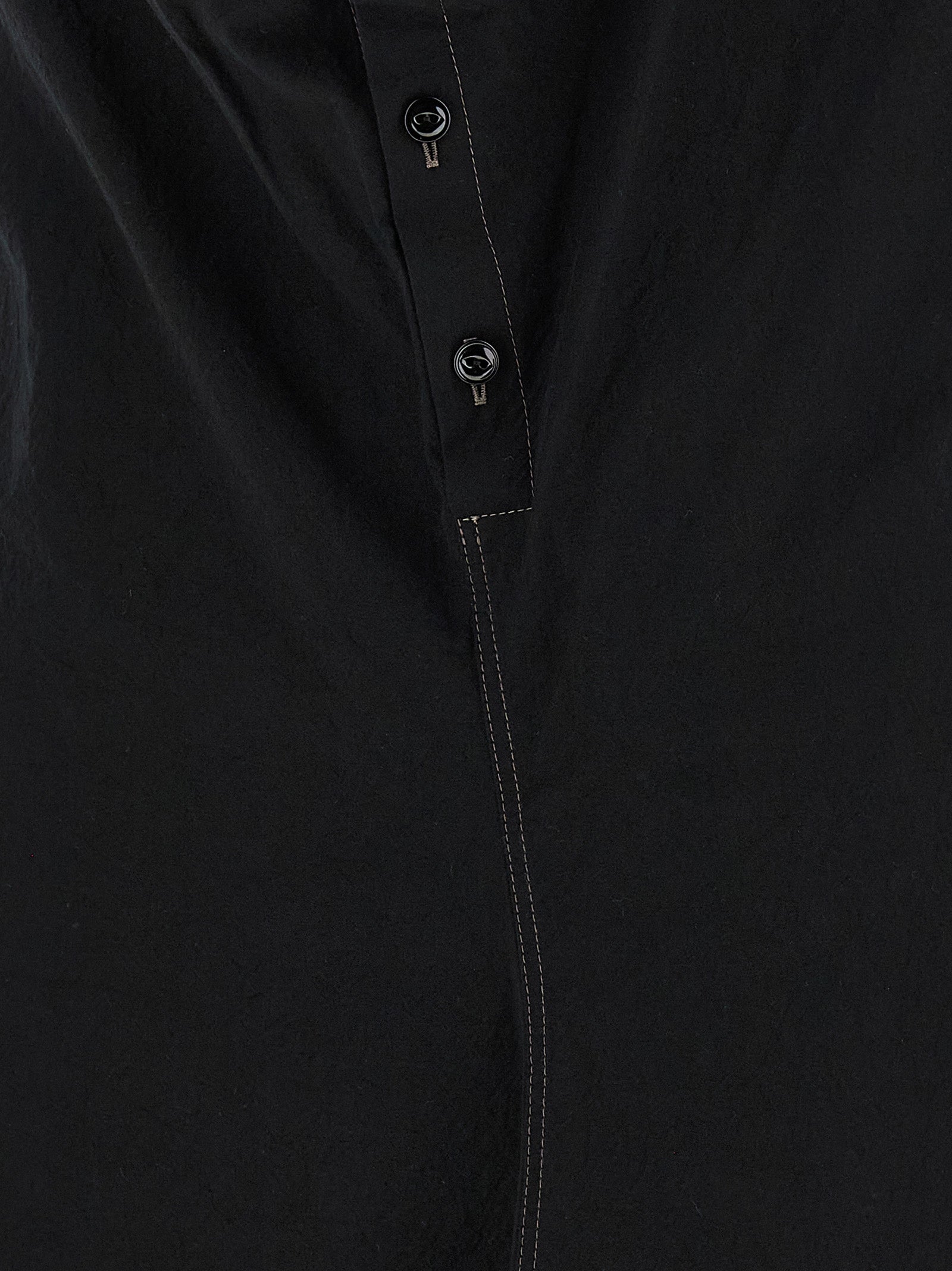 Discover the Lemaire Black Cotton Midi Dress, an embodiment of artisanal luxury, crafted from exquisite cotton crêpe for timeless elegance and effortless sophistication.