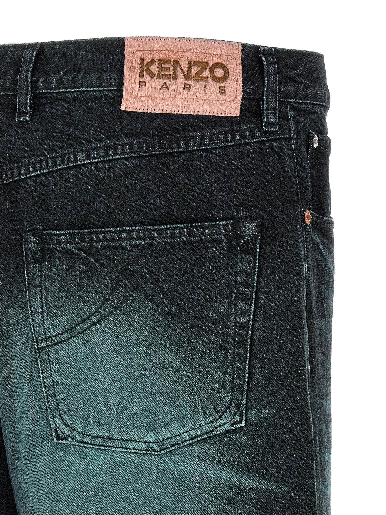 Indulge in KENZO's Blue Cotton Jeans, a luxurious blend of overdyed Kuroki denim, embodying timeless elegance and sophisticated artistry for the discerning individual.