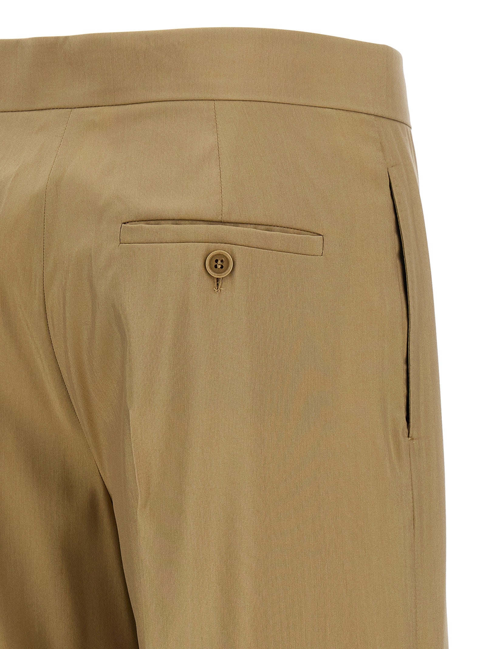 Experience the exquisite craftsmanship of Max Mara's Beige Virgin Wool Dress Pants, where luxurious materials meet timeless elegance, perfect for the discerning fashionista.