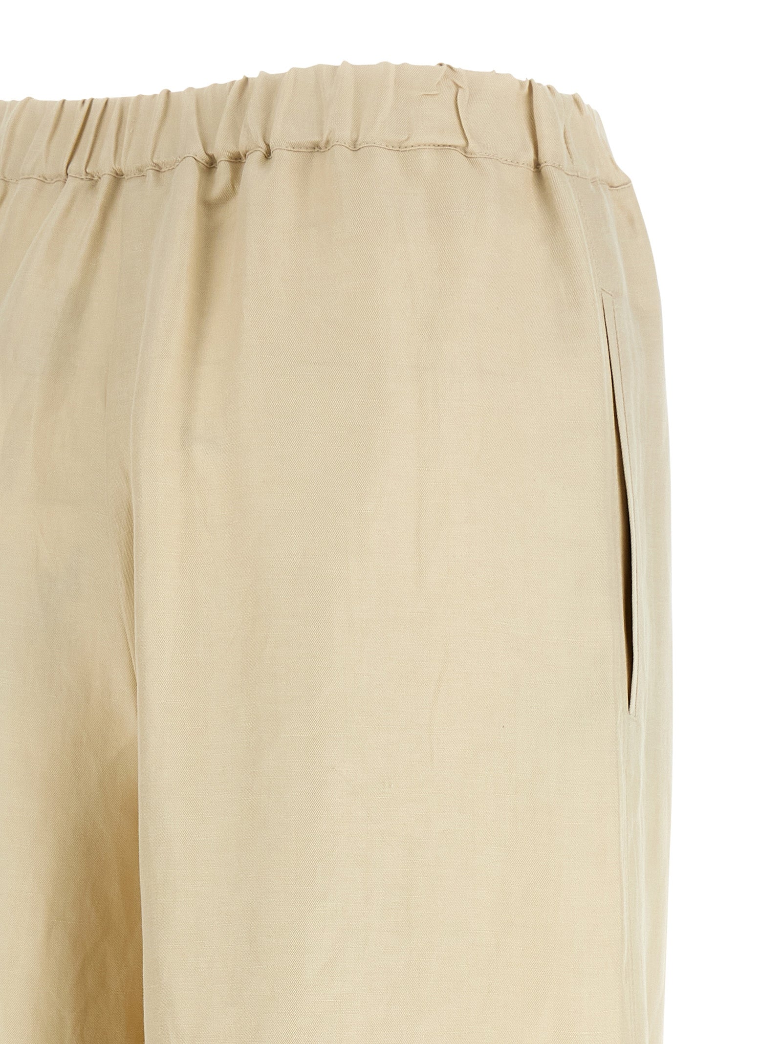Discover the Max Mara Beige Linen Casual Pants, a luxurious blend of linen and silk, embodying artisanal elegance for the discerning individual seeking timeless sophistication.