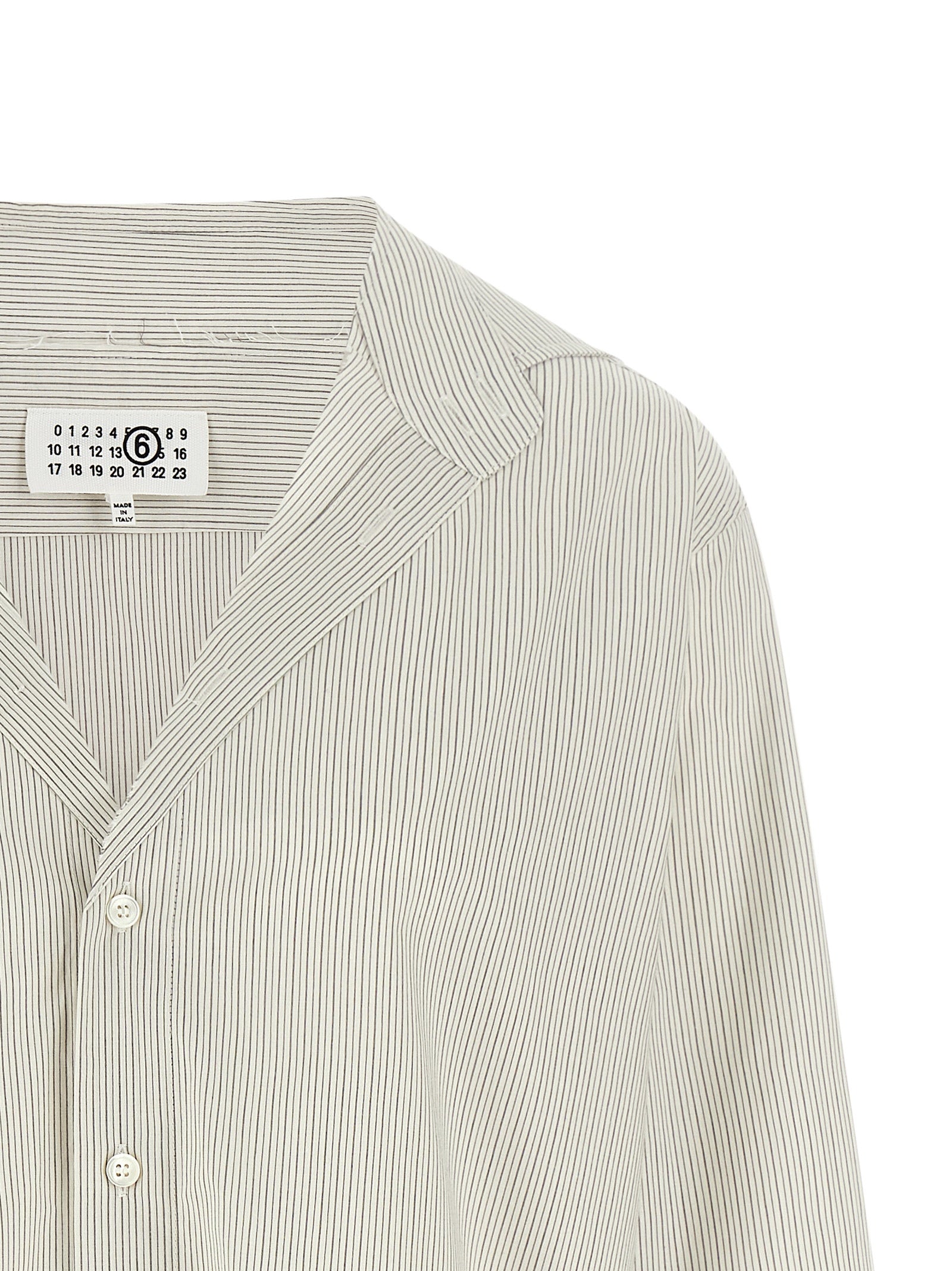 Elevate your wardrobe with the MM6 Maison Margiela Gray Cotton Blouse, a masterpiece of Italian craftsmanship that blends timeless elegance with modern allure.