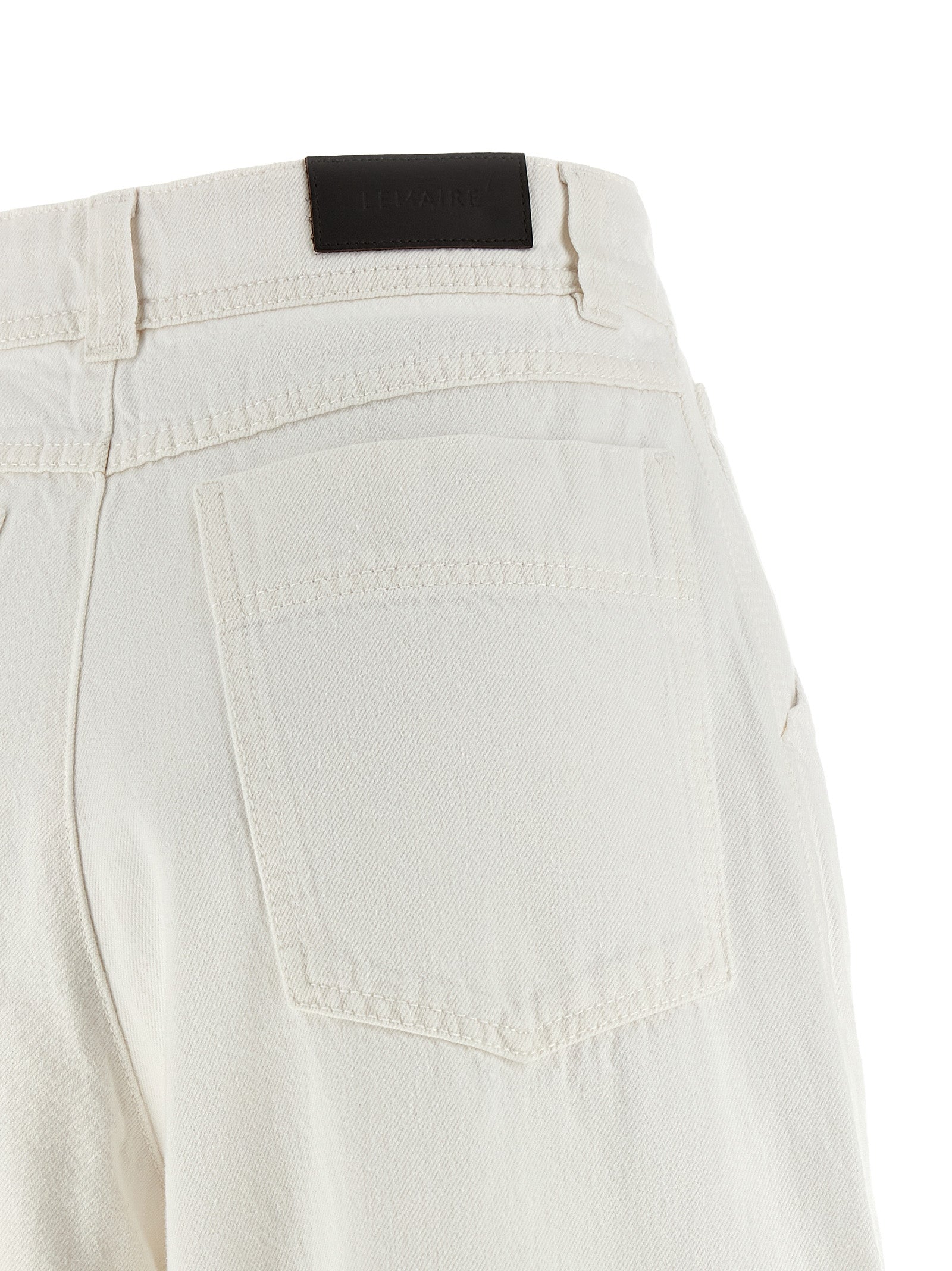 Elevate your style with Lemaire's White Cotton Jeans Denim, a luxurious blend of comfort and sophistication, perfect for the discerning wardrobe.