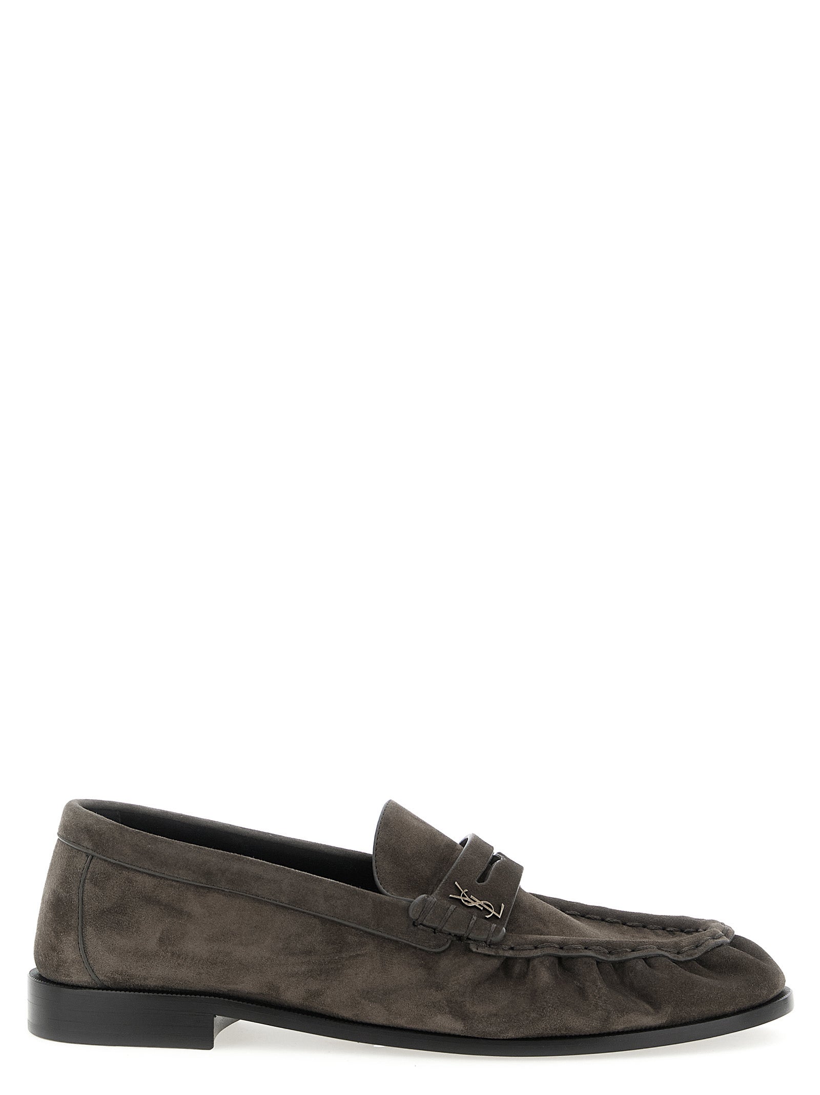 Indulge in the artisanal elegance of Saint Laurent's Brown Calfskin Slip-On Loafers, where luxurious craftsmanship meets timeless sophistication for the discerning individual.
