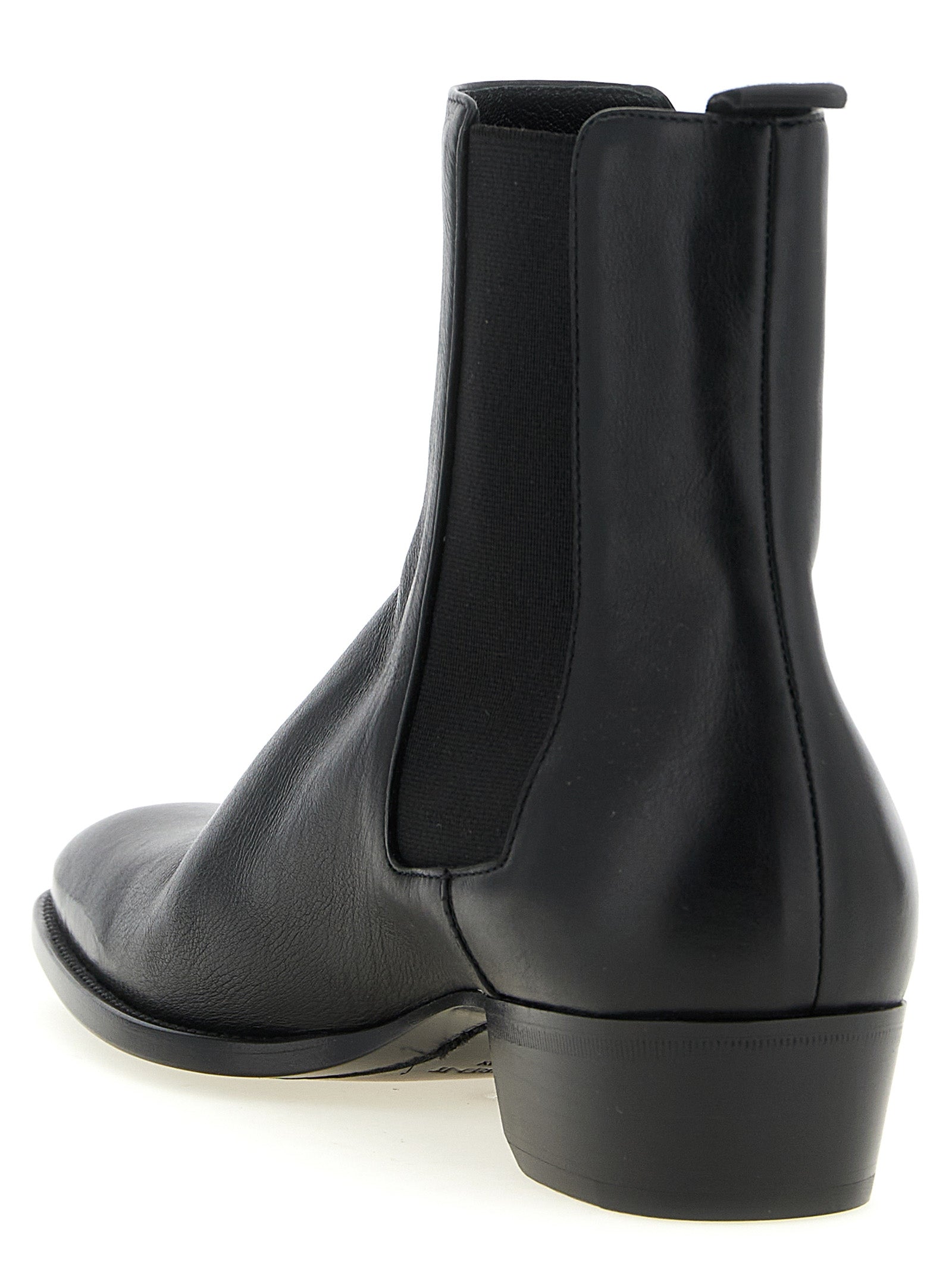 Experience the artisanal elegance of Saint Laurent Black Calfskin Chelsea Boots, crafted from luxurious leather for timeless sophistication and unmatched style.