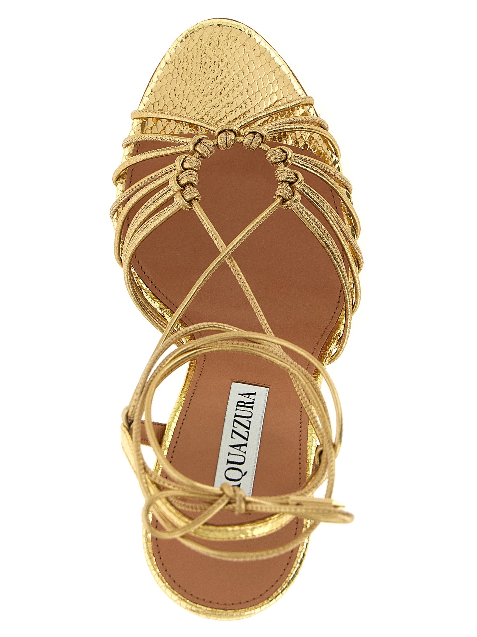 Step into luxury with Aquazzura's Gold Lamb Leather Stiletto Heel Sandals, where exquisite craftsmanship meets timeless elegance for the discerning fashion connoisseur.