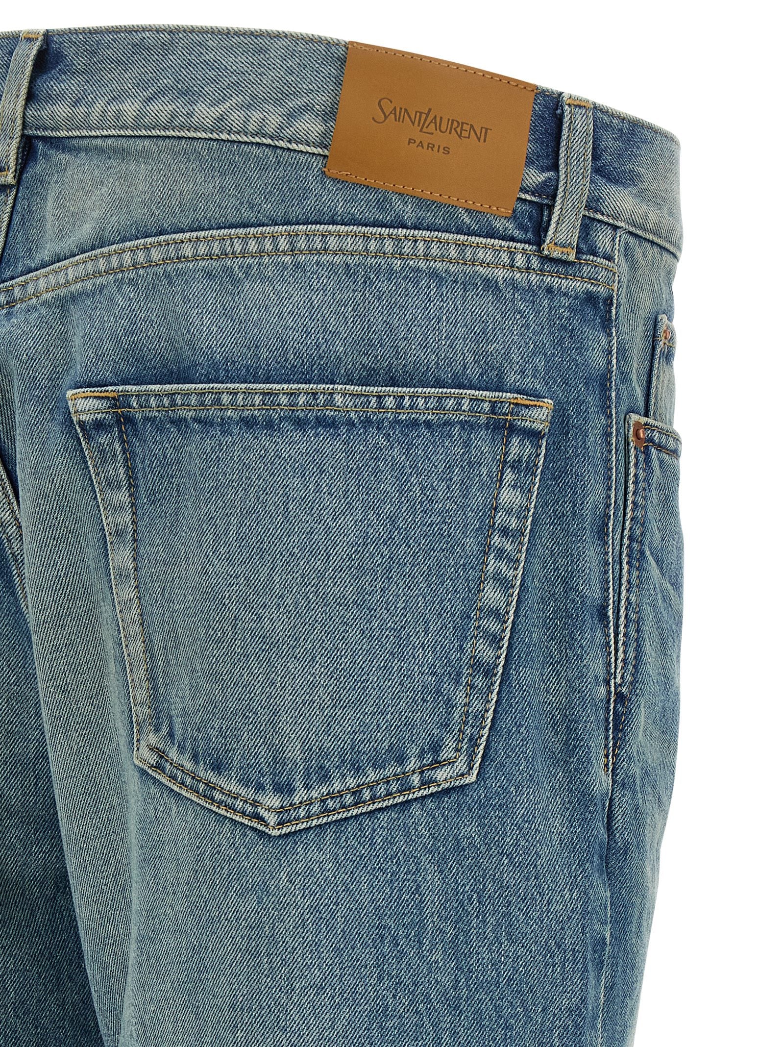 Elevate your wardrobe with Saint Laurent's Blue Cotton Straight-Leg Jeans, where exquisite craftsmanship meets timeless luxury for the discerning connoisseur.