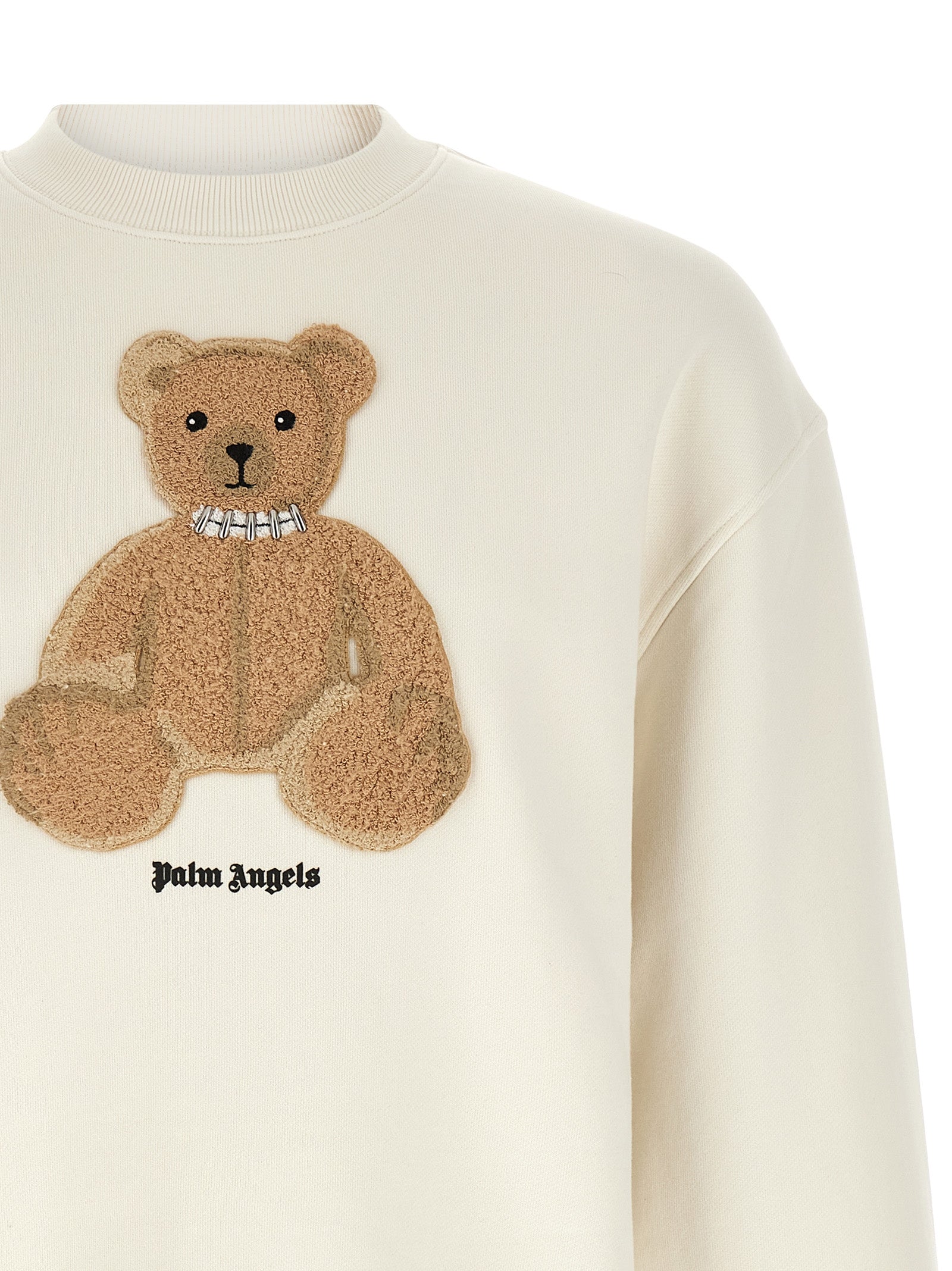 Elevate your wardrobe with the Palm Angels White Cotton Sweatshirt, a luxurious blend of comfort and style, featuring a distinctive bear patch for the discerning trendsetter.