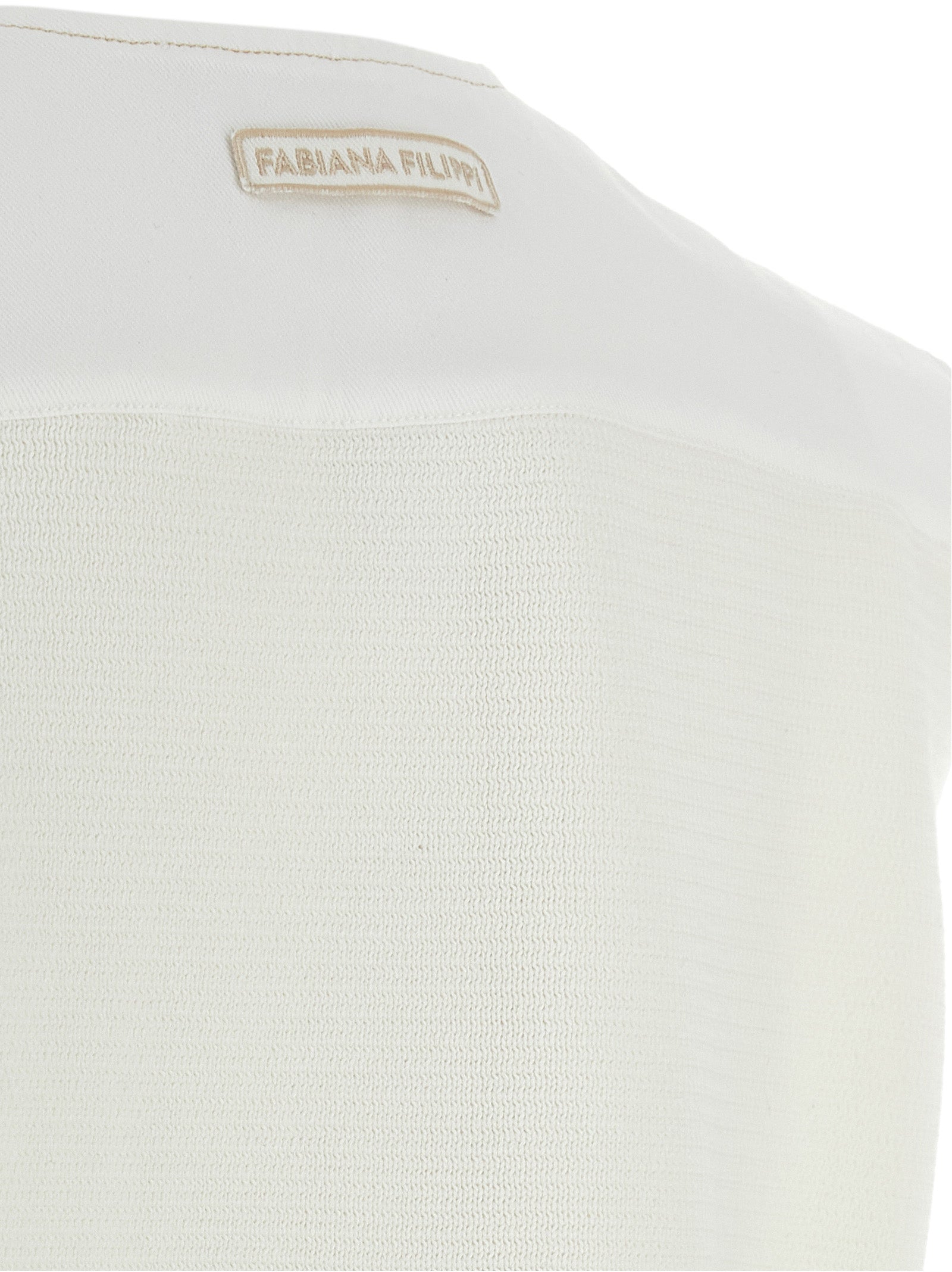 Discover the Fabiana Filippi White Cotton Sleeveless Jacket, a masterpiece of Italian craftsmanship that embodies timeless elegance and sophistication for the discerning individual.